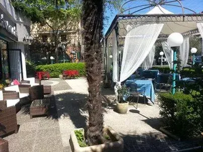 Patio, Swimming Pool in Platani Hotel