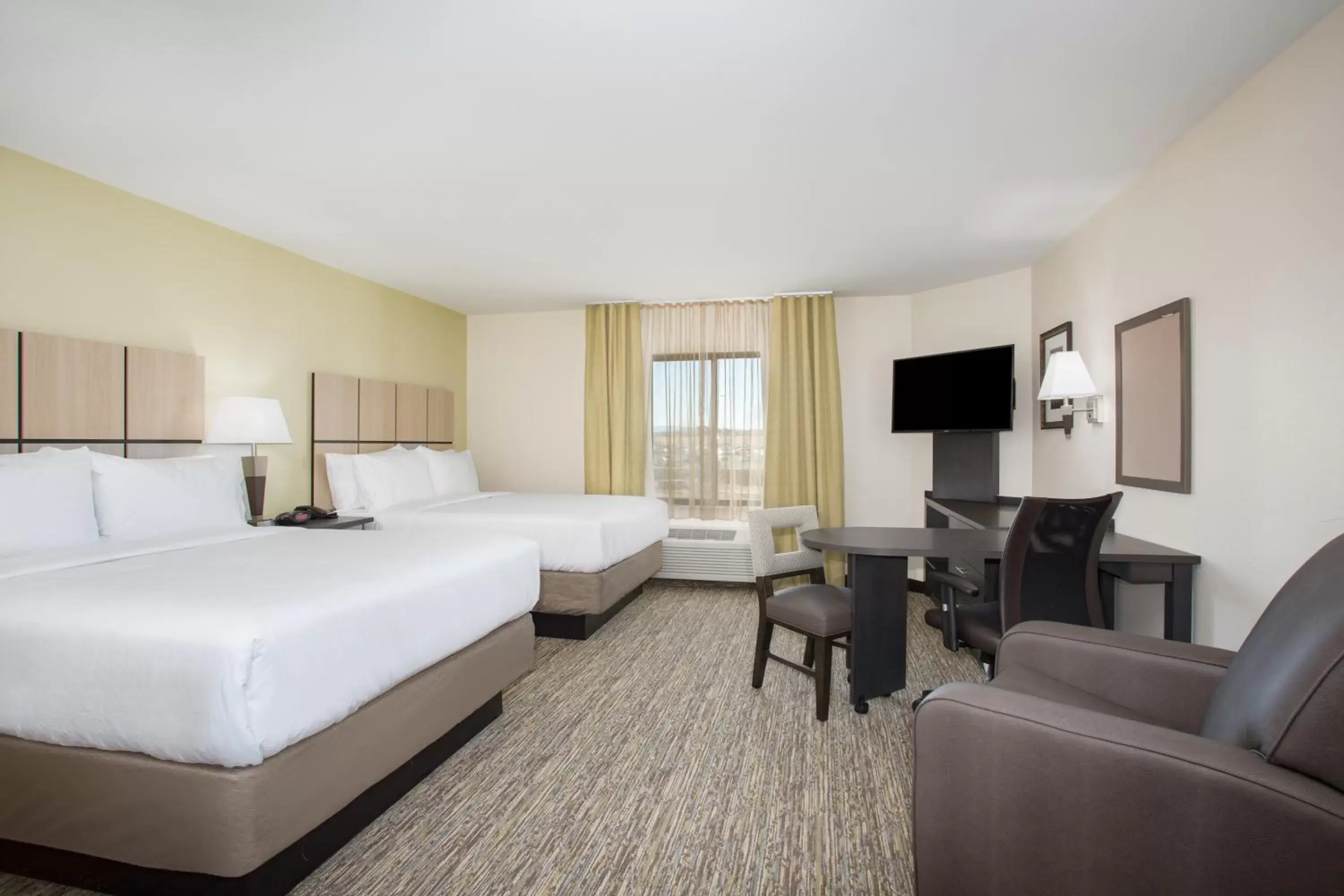 Bed in Candlewood Suites Pueblo, an IHG Hotel