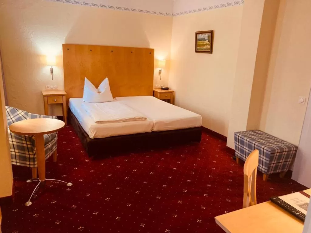 Bed in Hotel Rosenheimer Hof