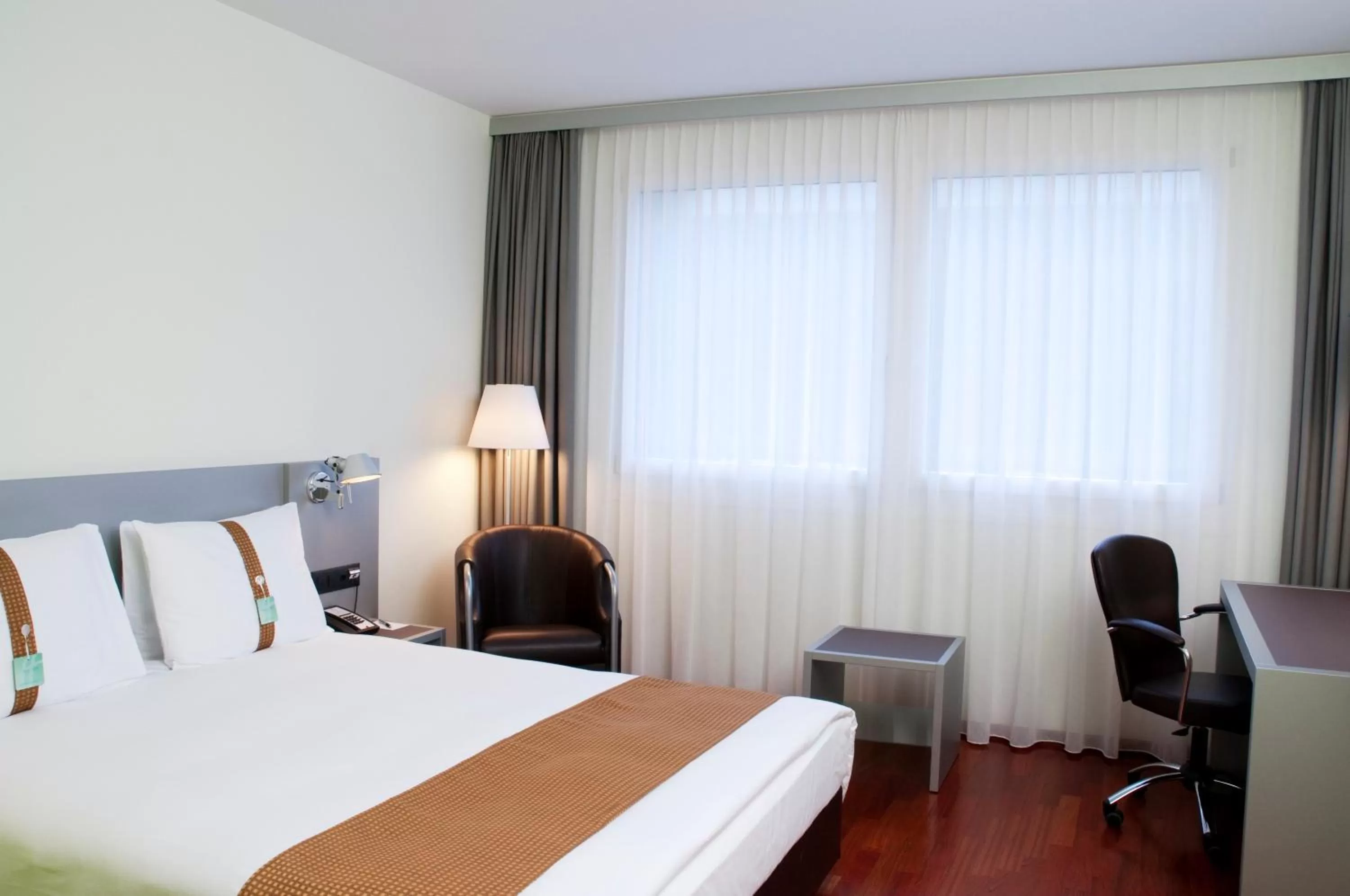 Photo of the whole room, Bed in Holiday Inn Zürich Messe by IHG