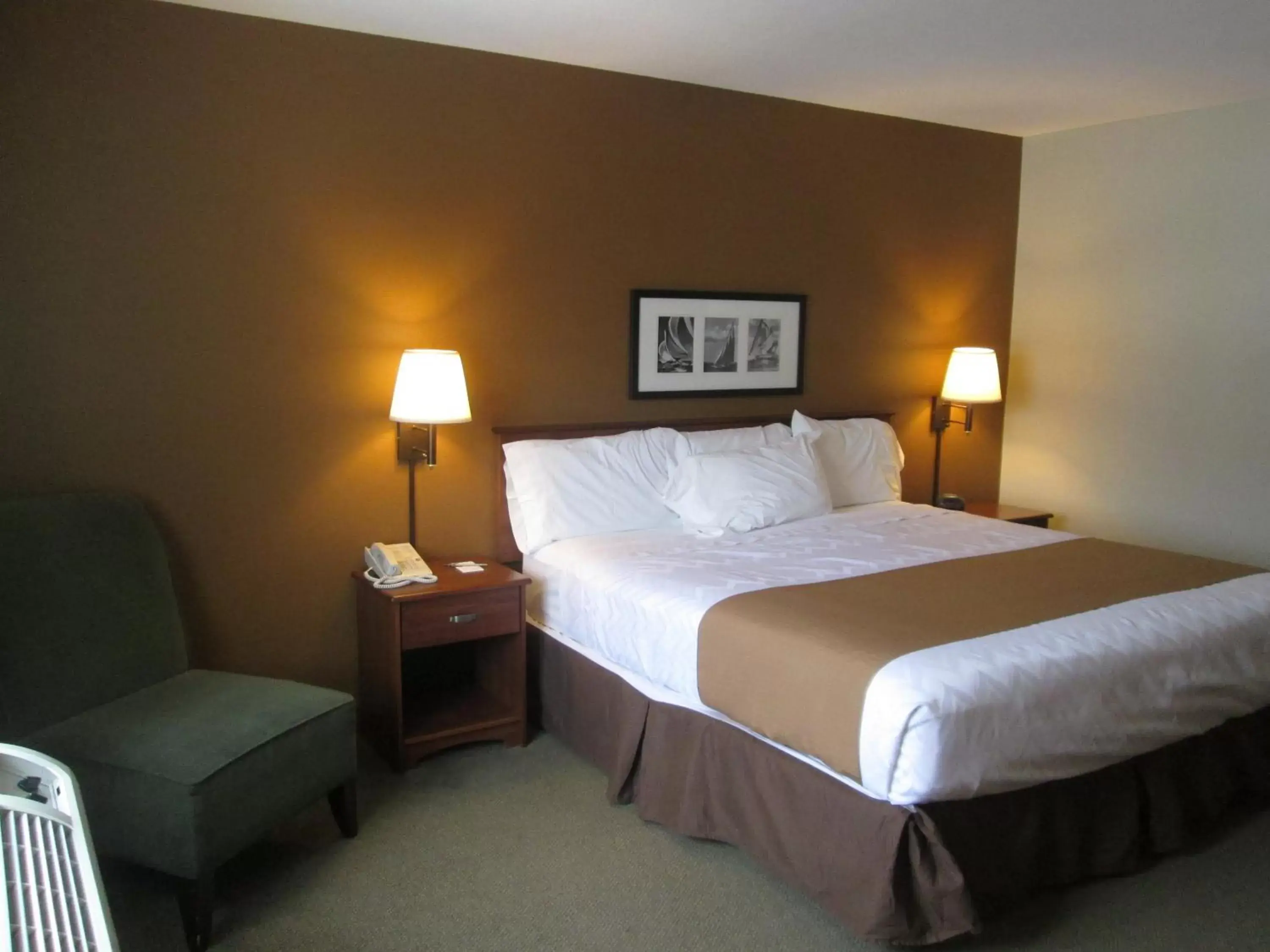 Bed in AmericInn by Wyndham Charlevoix