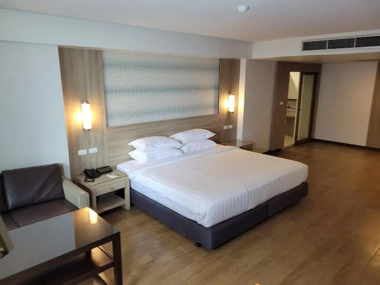 Bed in Dynasty Grande Hotel