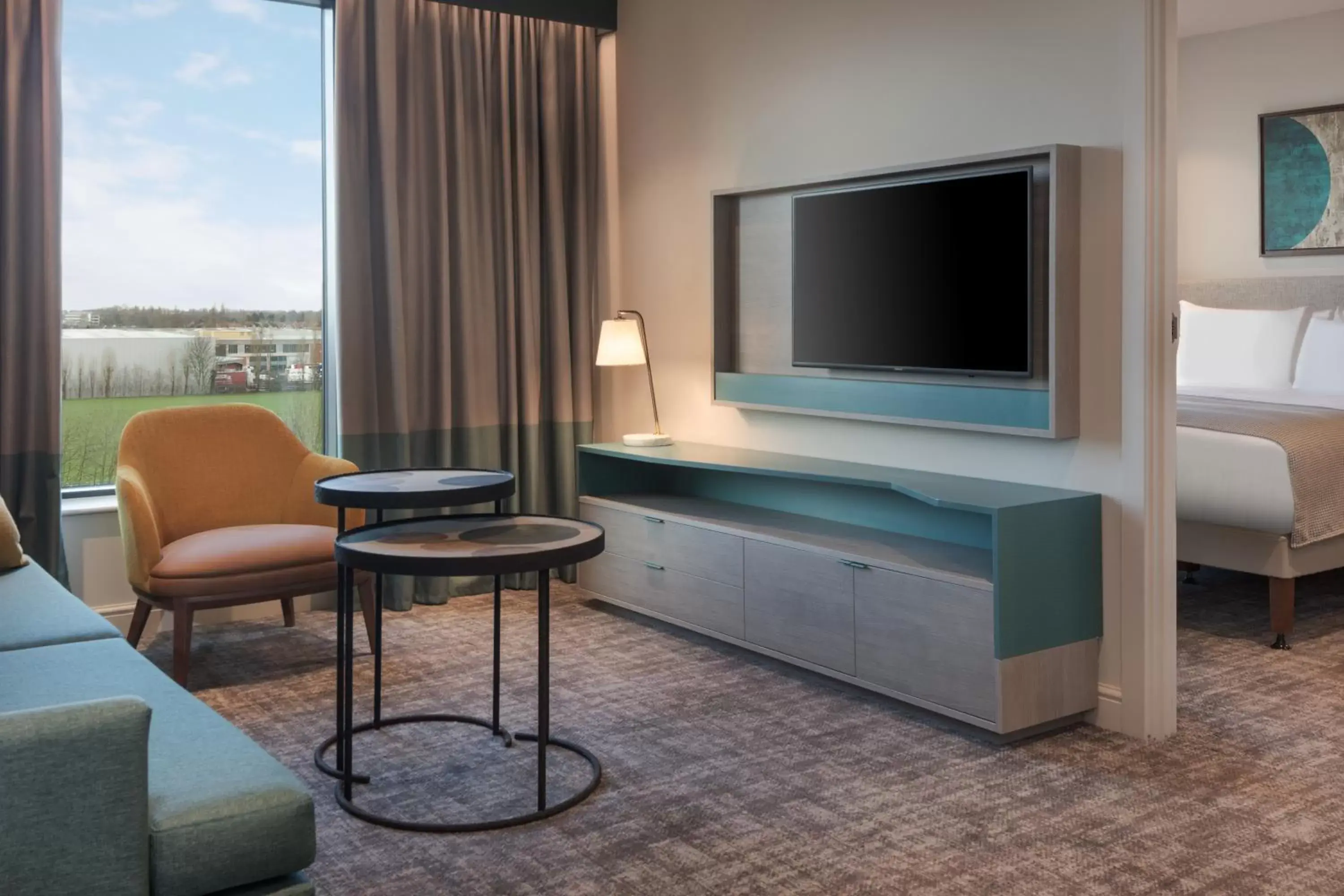 Bed, TV/Entertainment Center in Staybridge Suites London Heathrow - Bath Road, an IHG Aparthotel