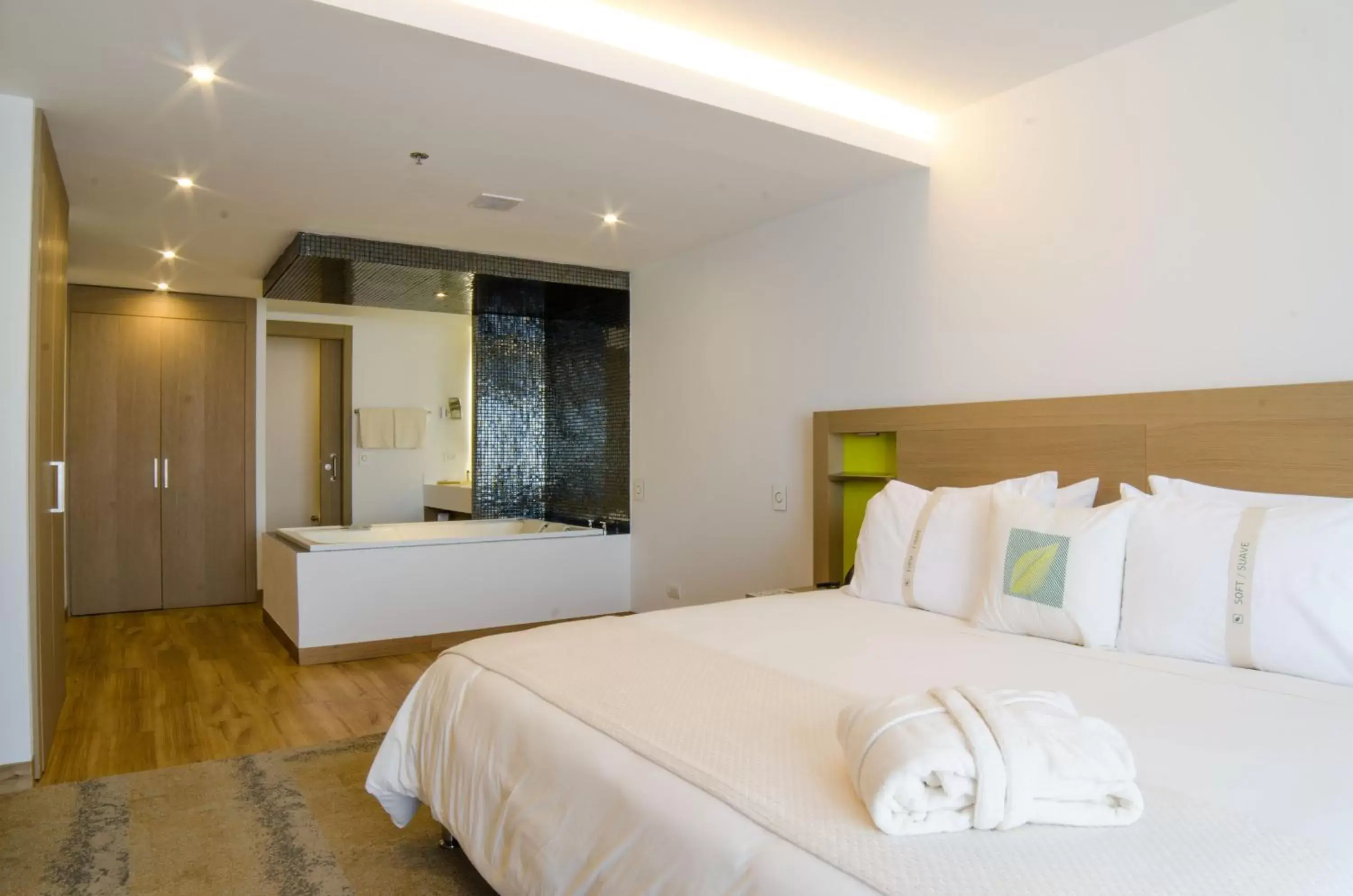 Bed in Biohotel Organic Suites