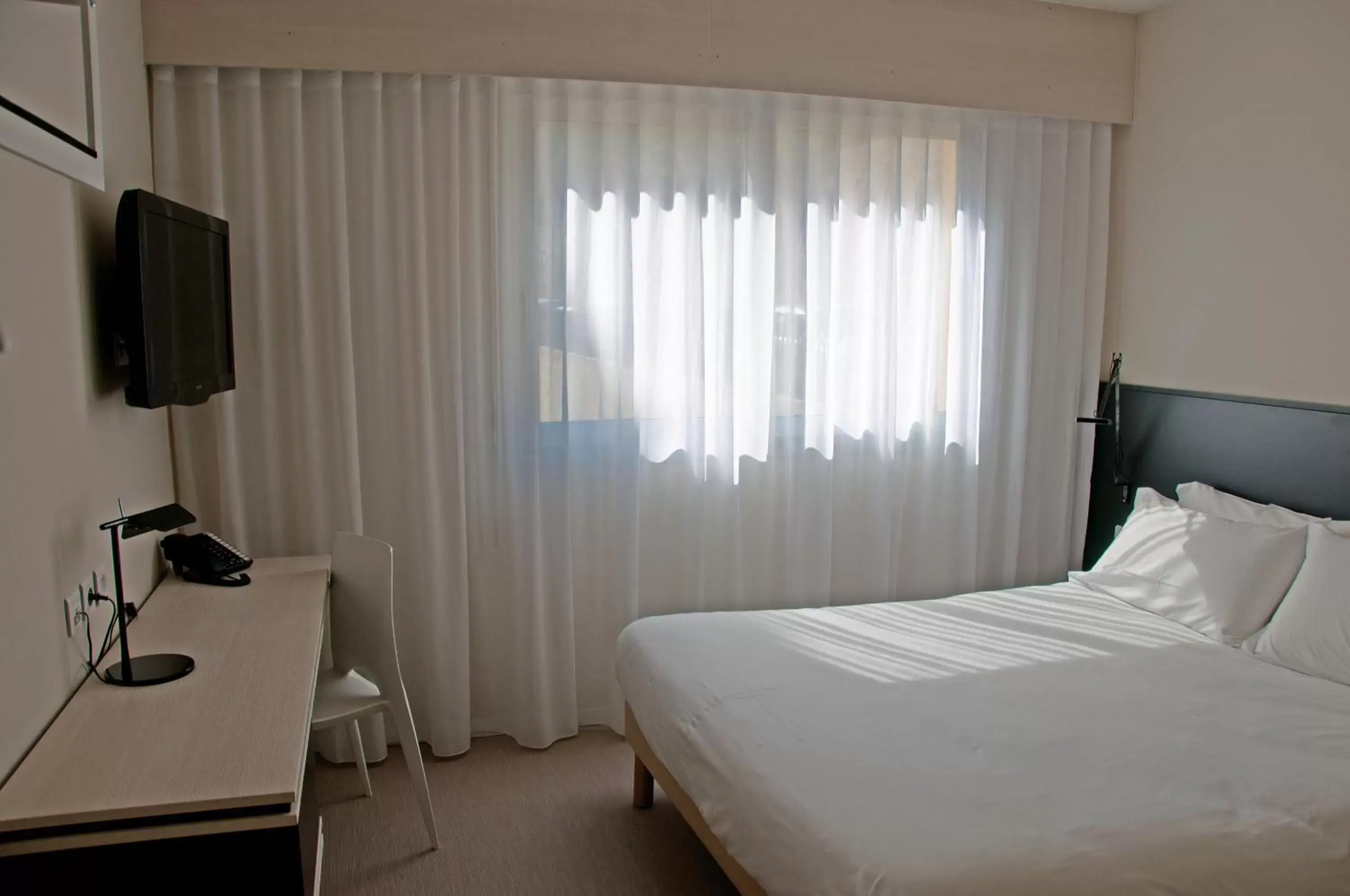 Bed in Hotel Palm Garavan