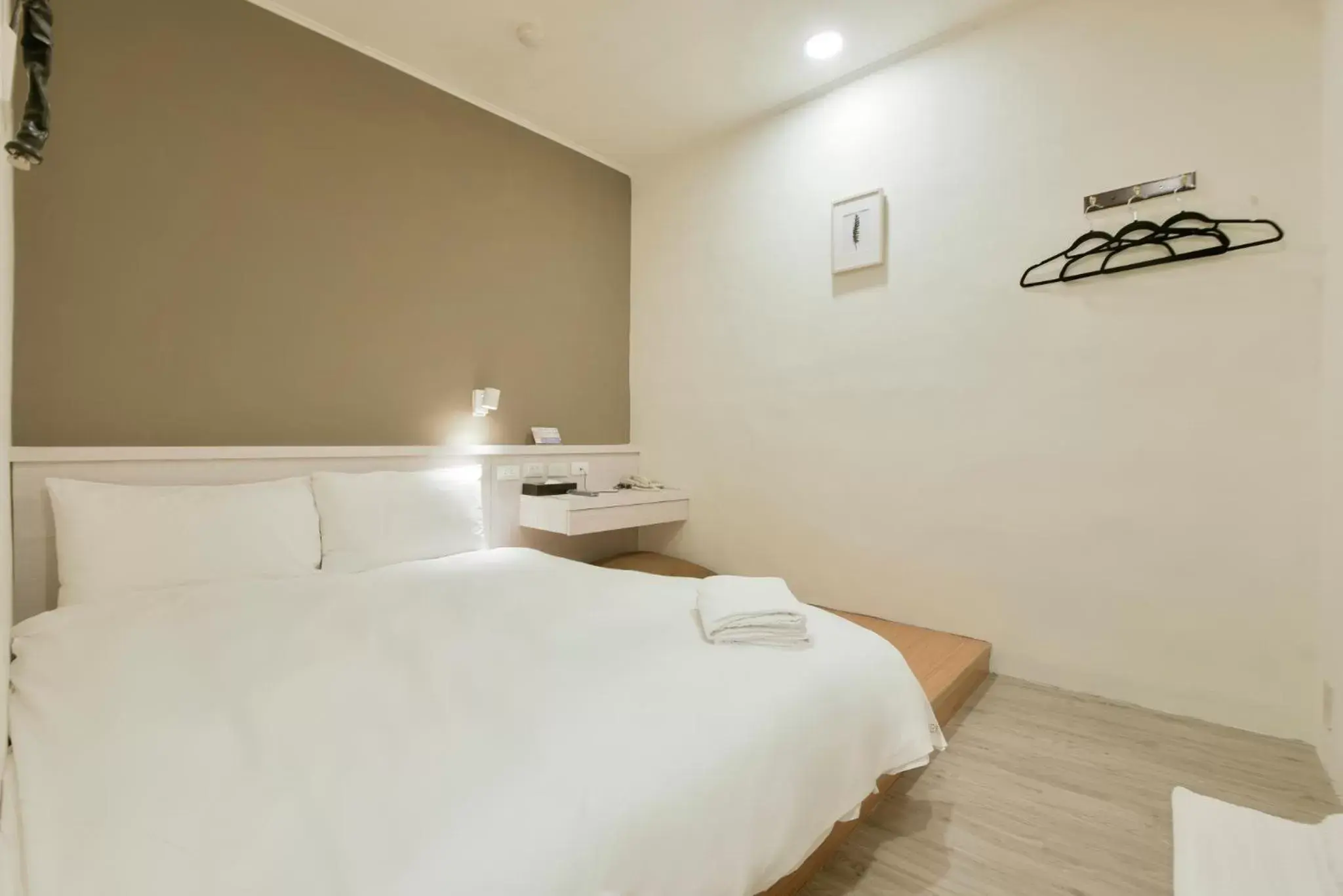 Bed in Raise Hotel Taichung