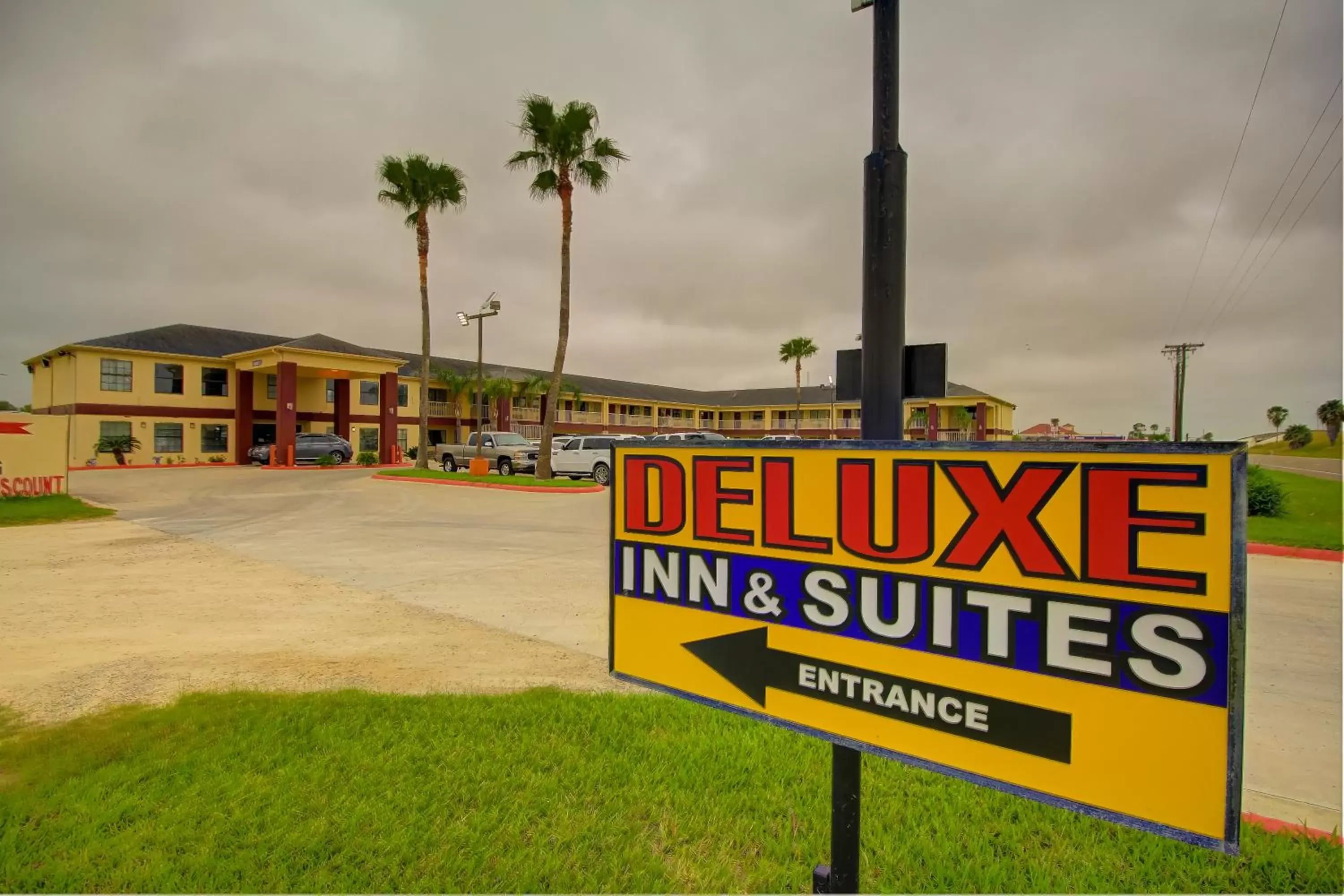 Property logo or sign in Deluxe Inn and Suites