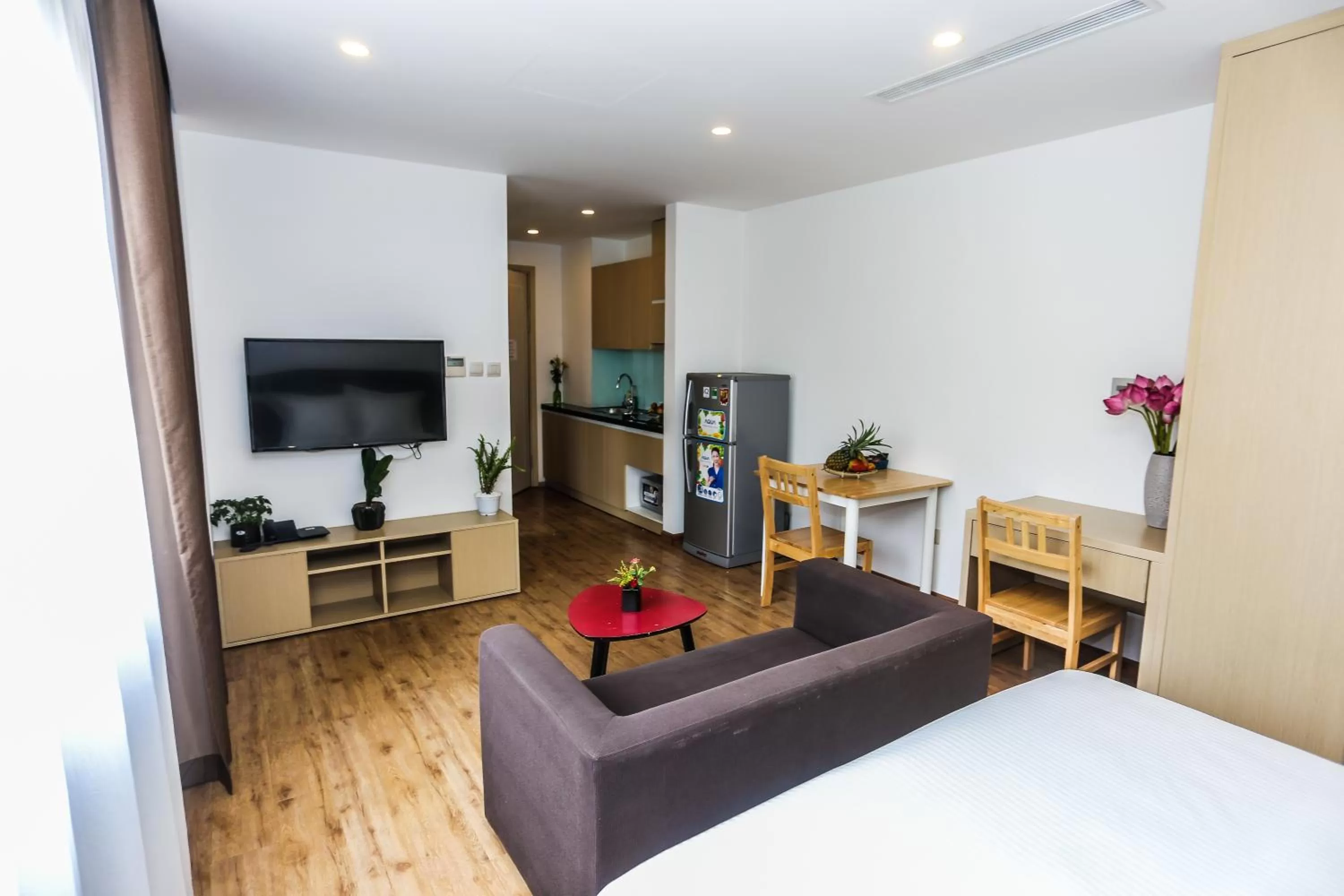 Living room, Bed in HNC Premier Hotel & Residences