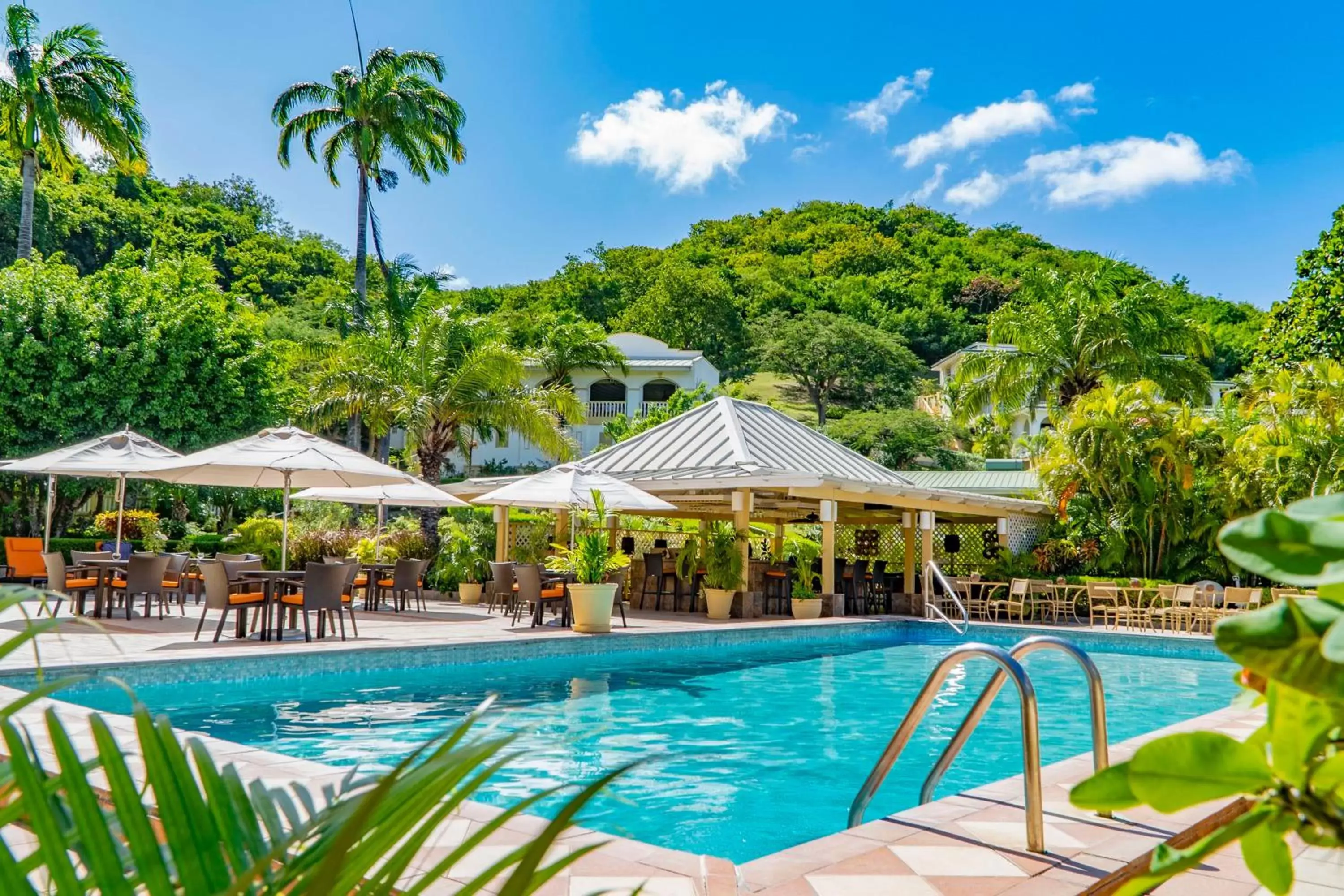 Patio, Swimming Pool in Blue Horizons Garden Resort