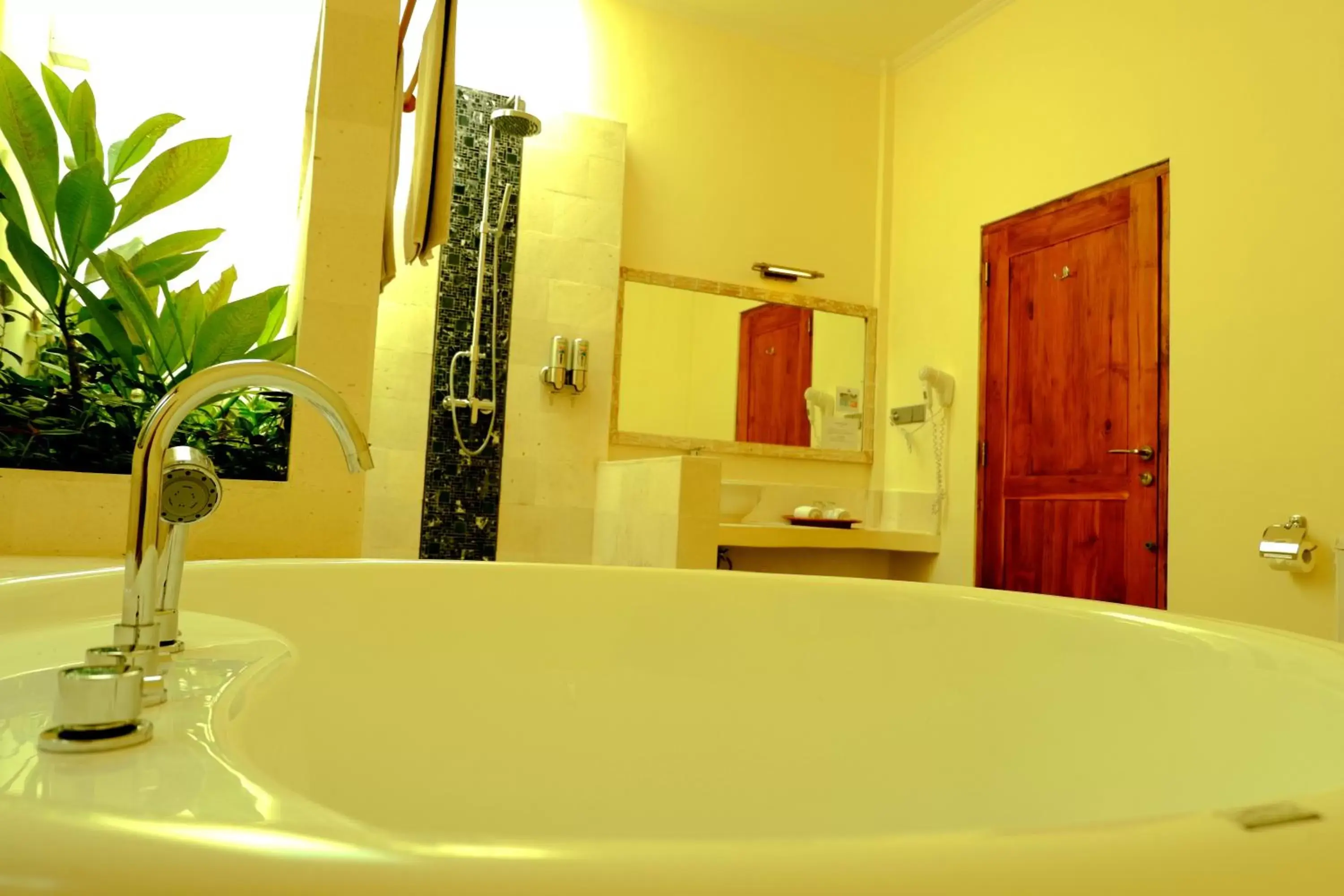 Bed, Bathroom in Puri Sari Beach Hotel