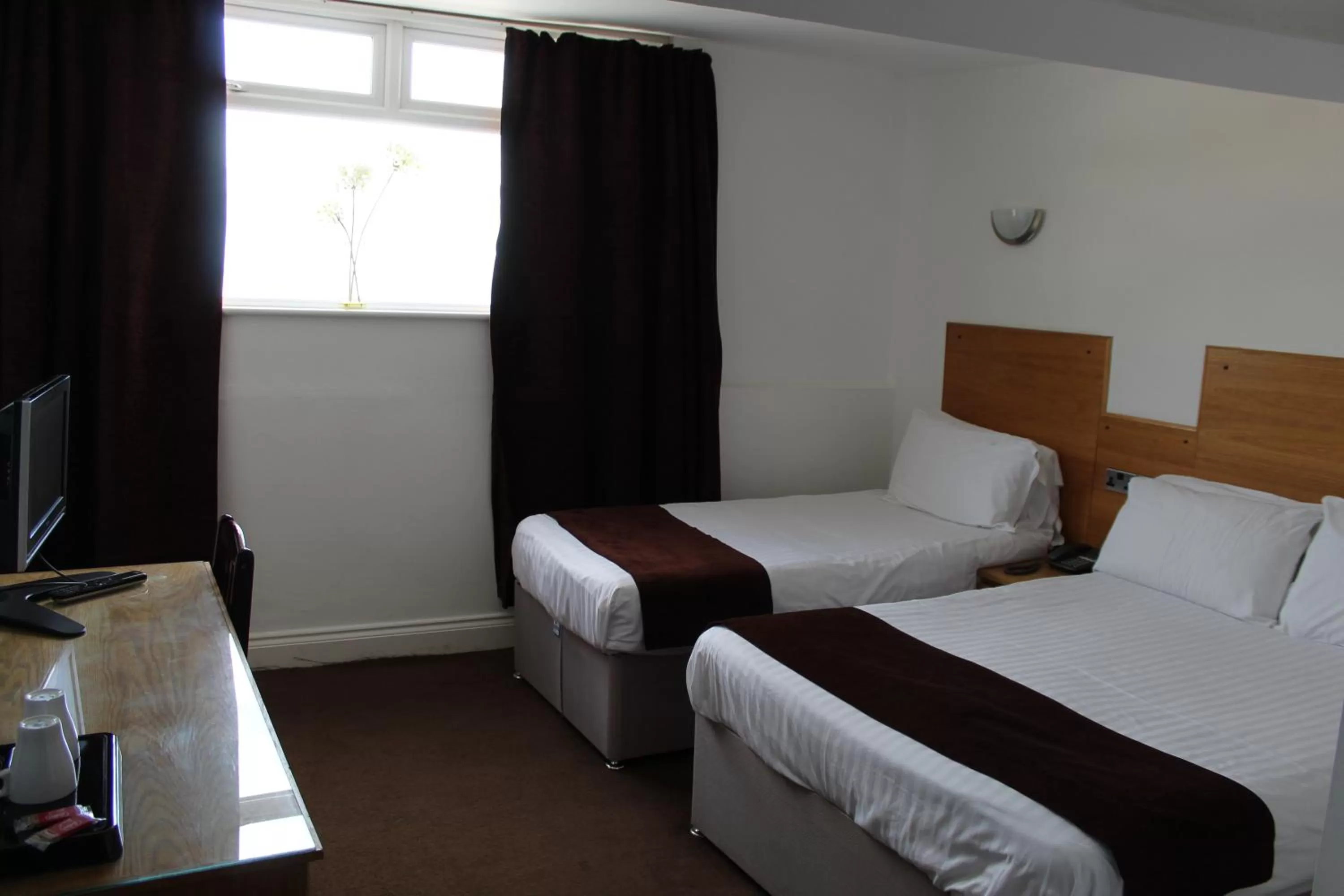 Bed in Four Saints Brig Y Don Hotel