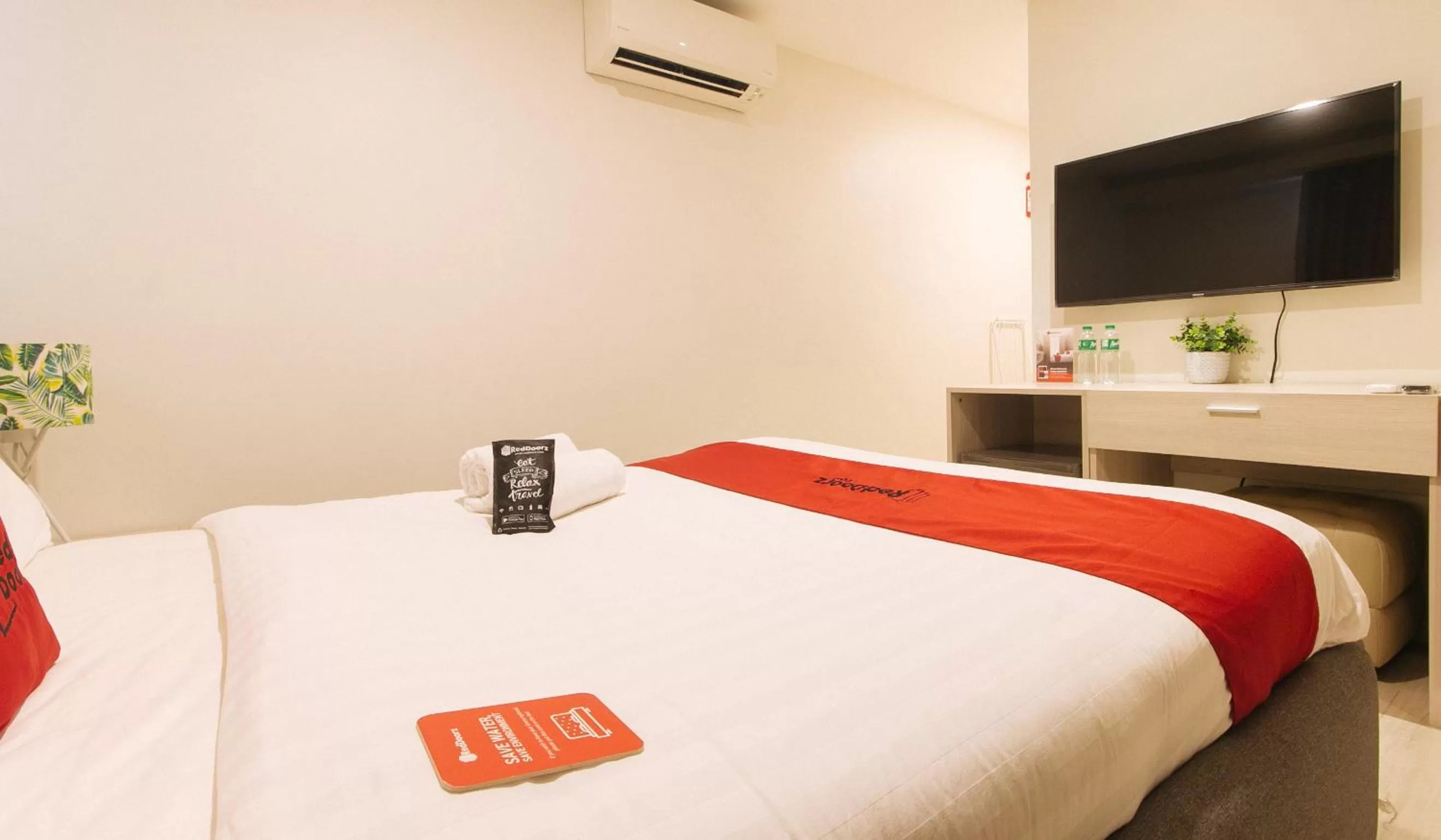 TV and multimedia, Bed in RedDoorz Plus at La Belle Residences Makati City