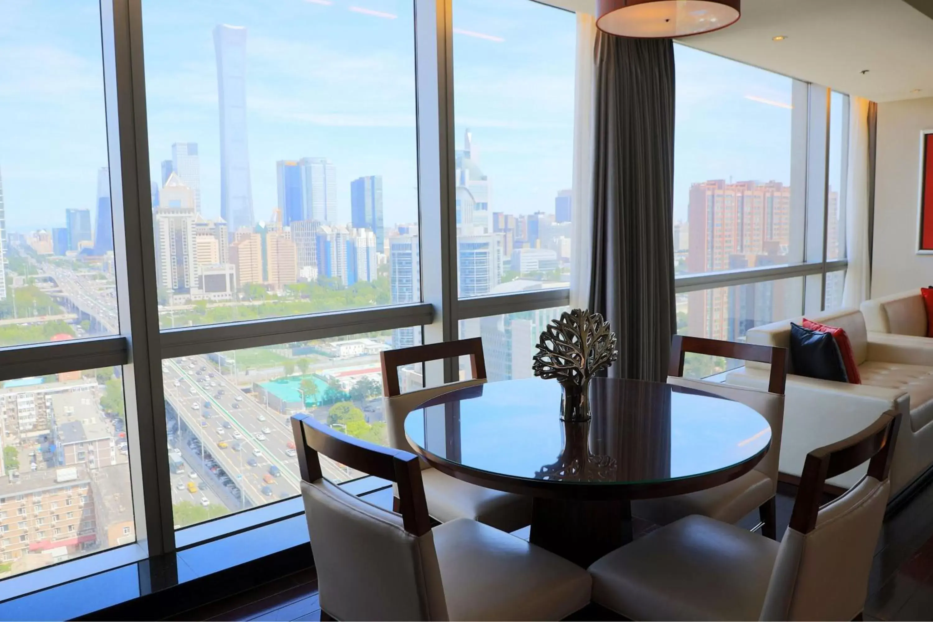Living room, Dining Area in Renaissance Beijing Capital Hotel