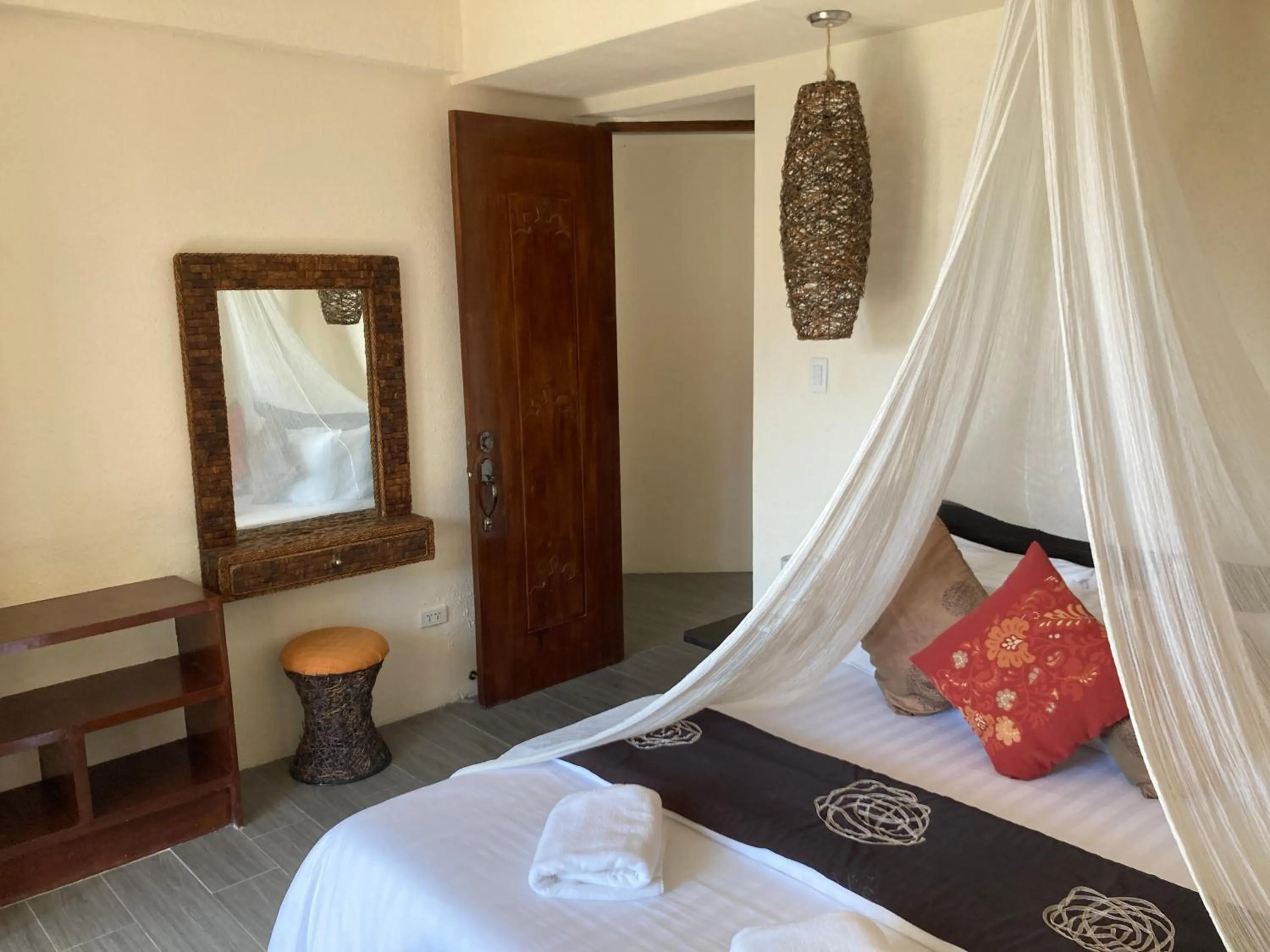 Bed in Sunset At Aninuan Beach Resort