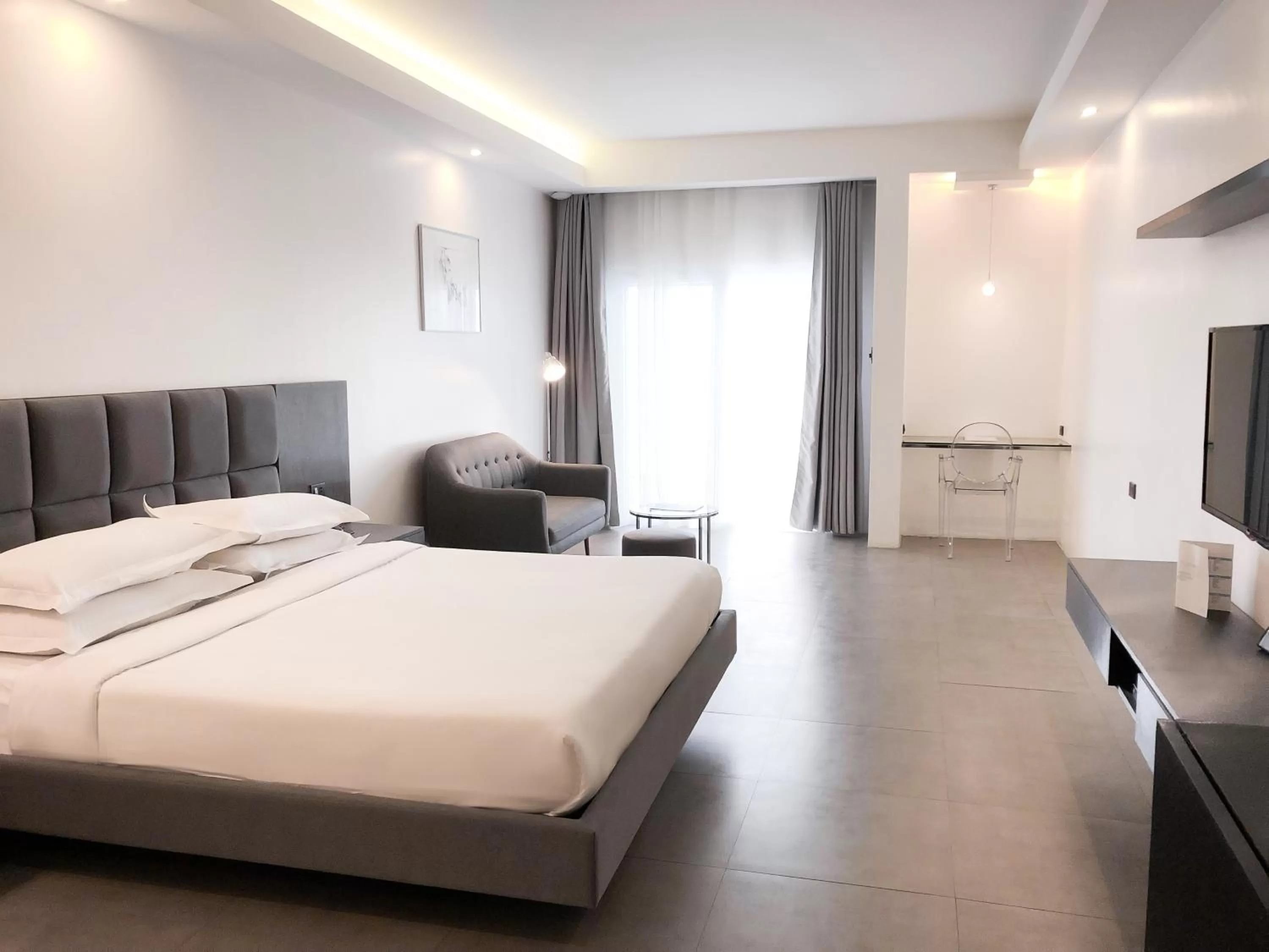 Photo of the whole room, Bed in Winds Boutique Hotel