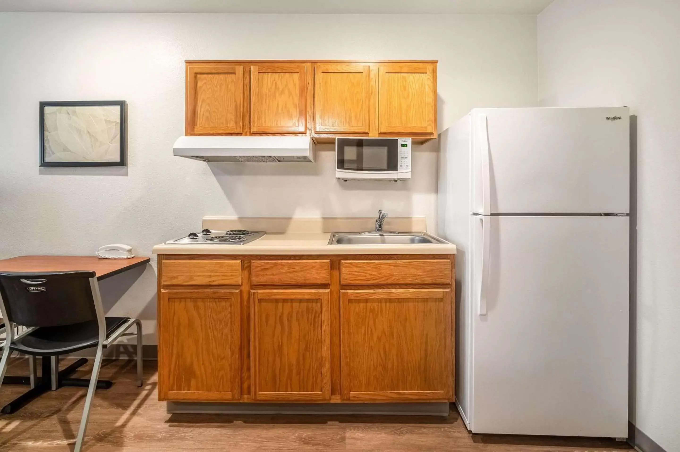 Photo of the whole room, Kitchen/Kitchenette in WoodSpring Suites Corpus Christi