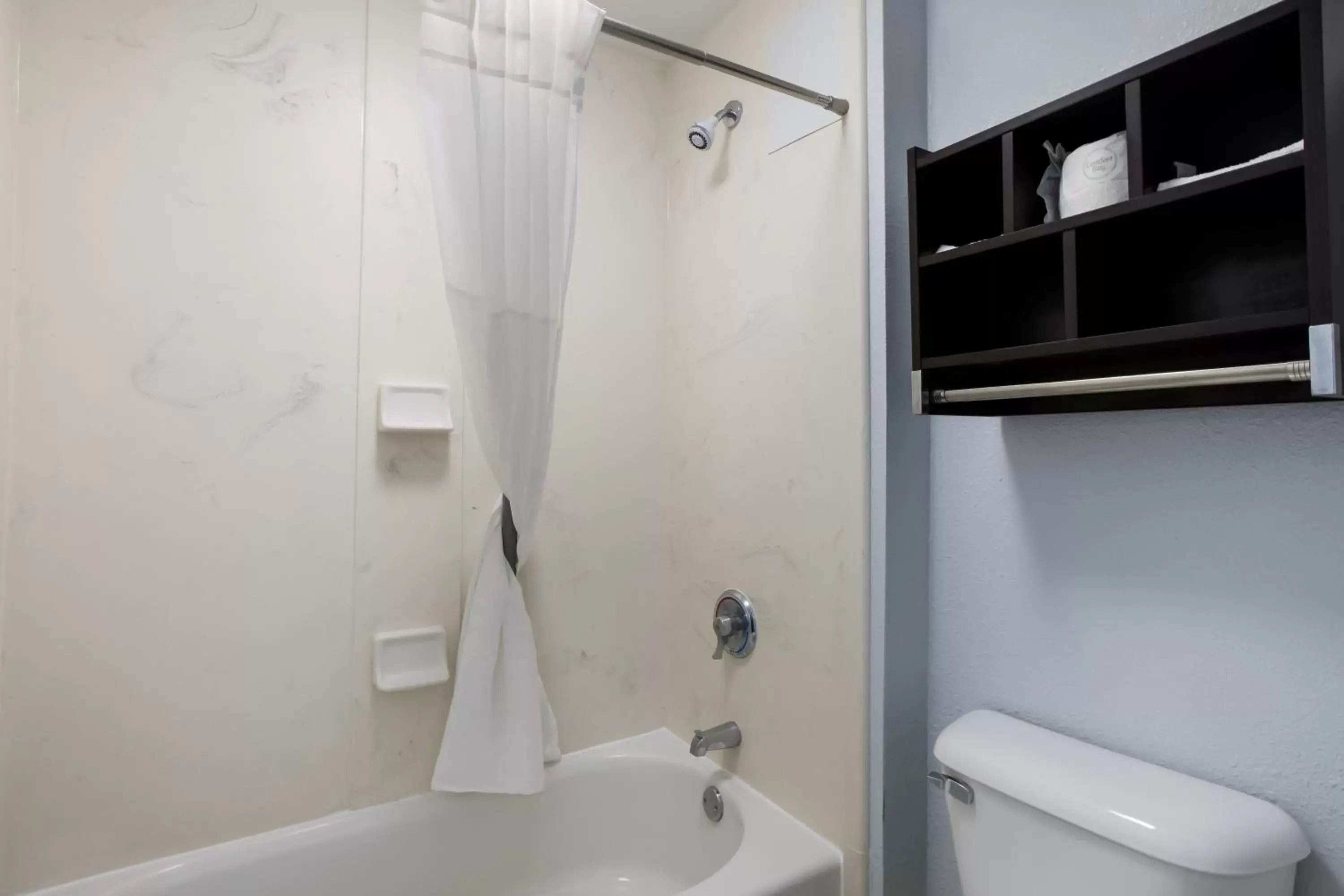 Shower, Bathroom in Suburban Studios