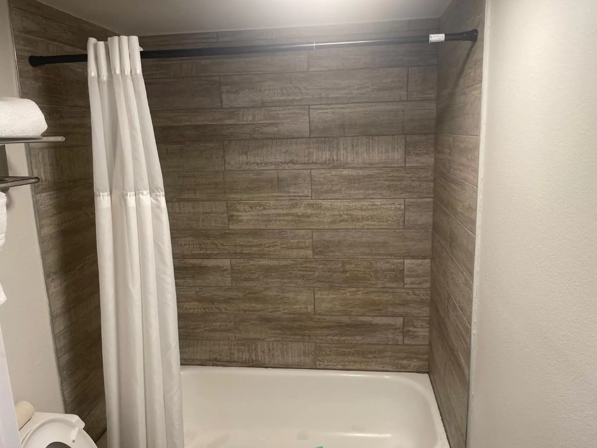 Shower, Bathroom in Days Inn & Suites by Wyndham Orlando East UCF Area