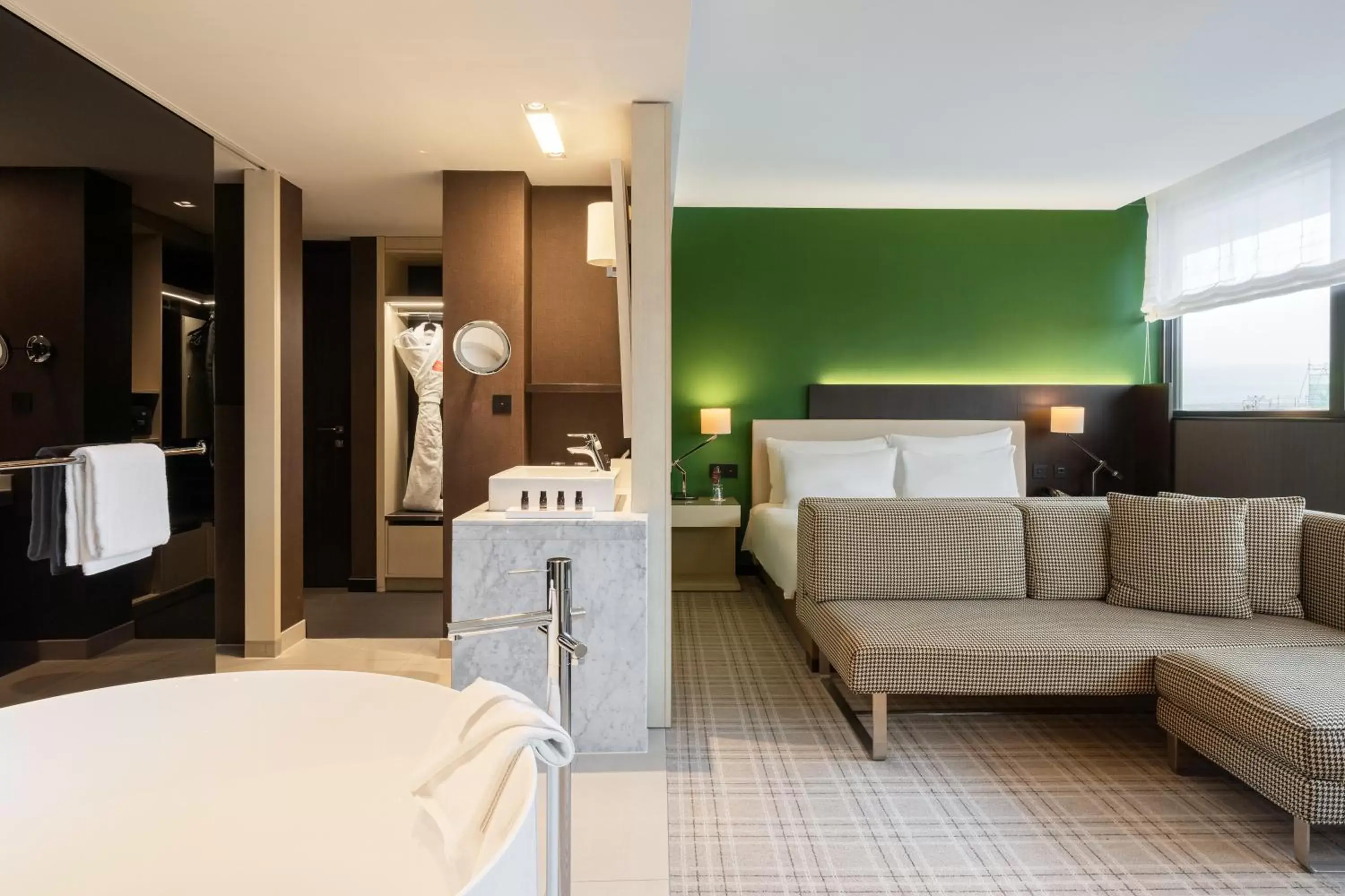 Bathroom, Bed in Crowne Plaza Geneva, an IHG Hotel