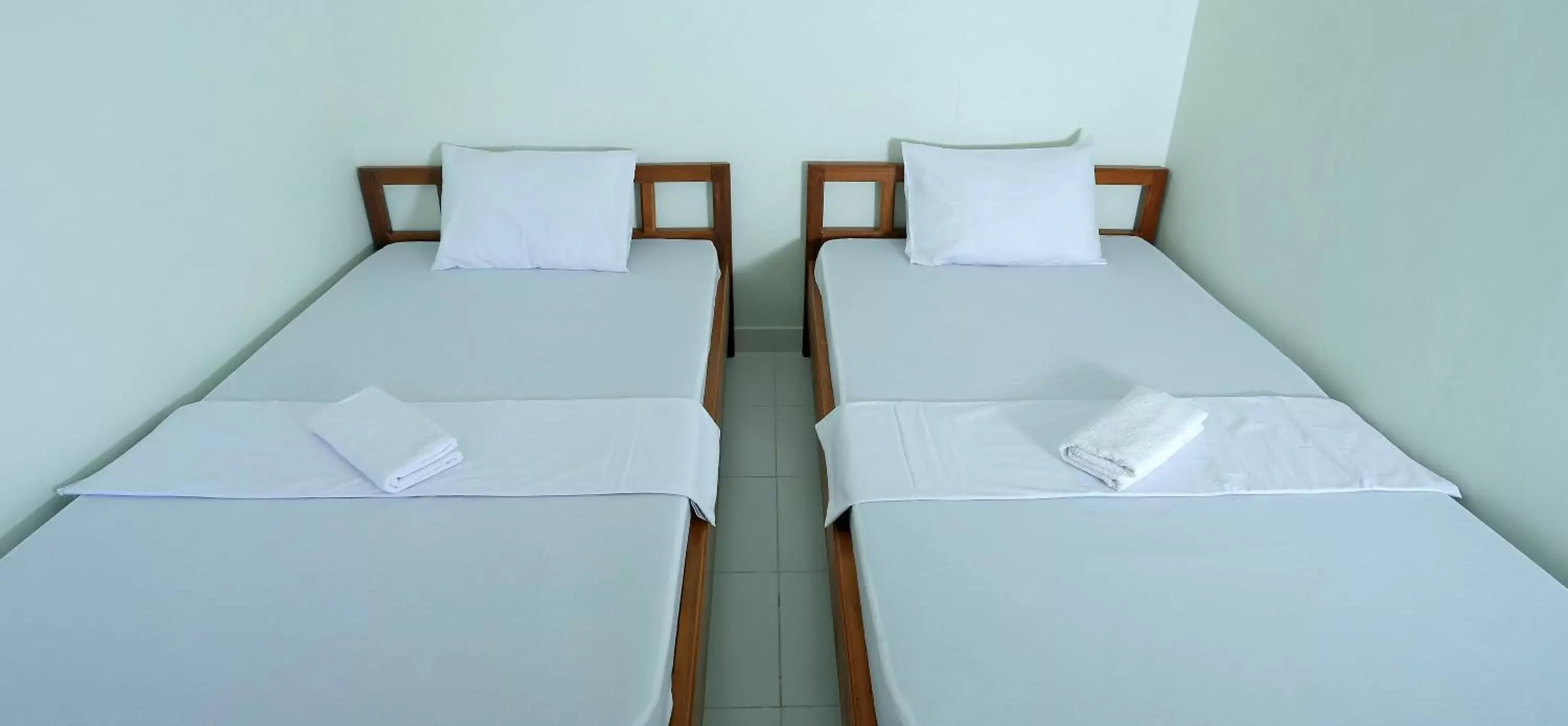 Bed in Jazz Senggigi Hotel