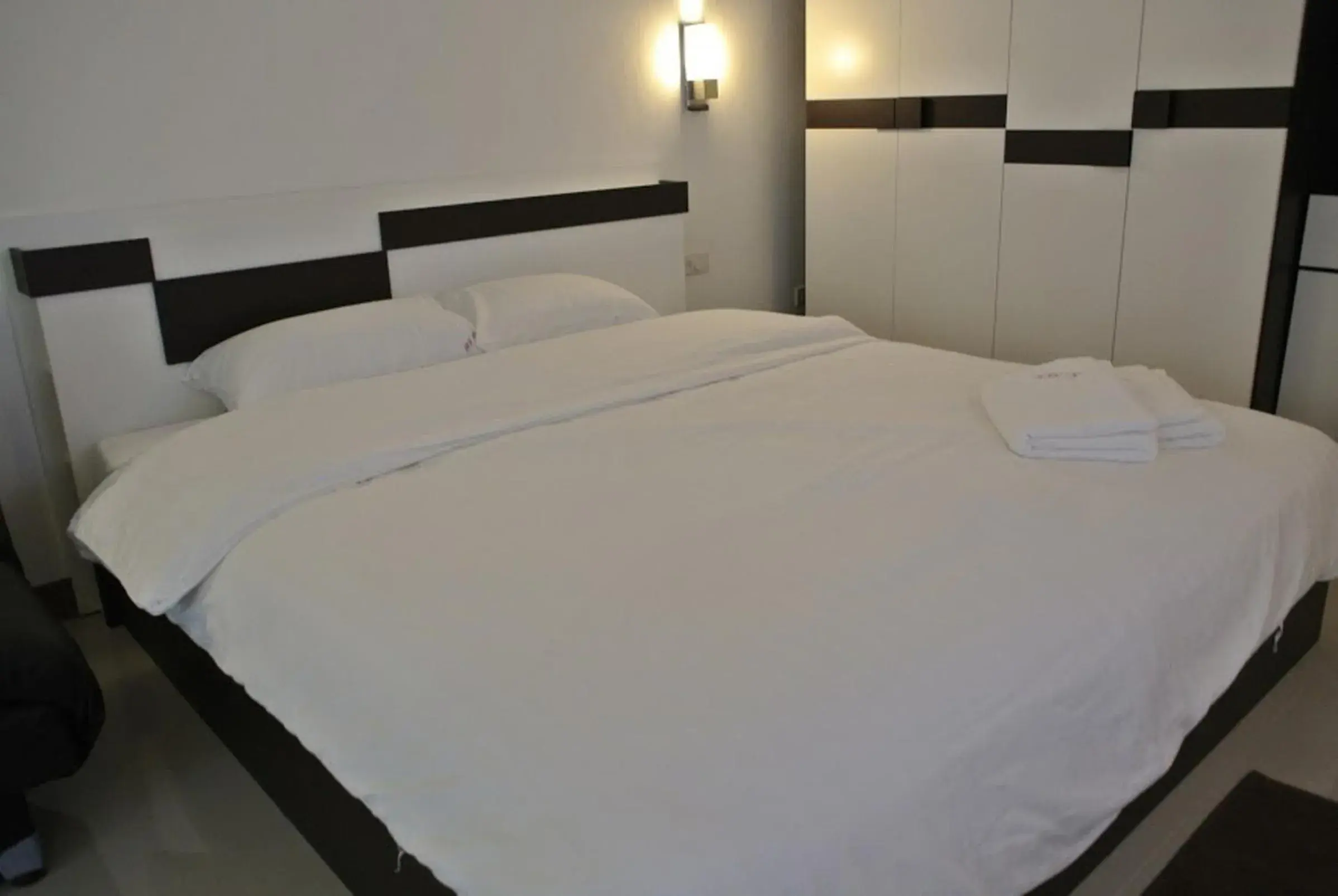 Bed in Sri Samui Hotel