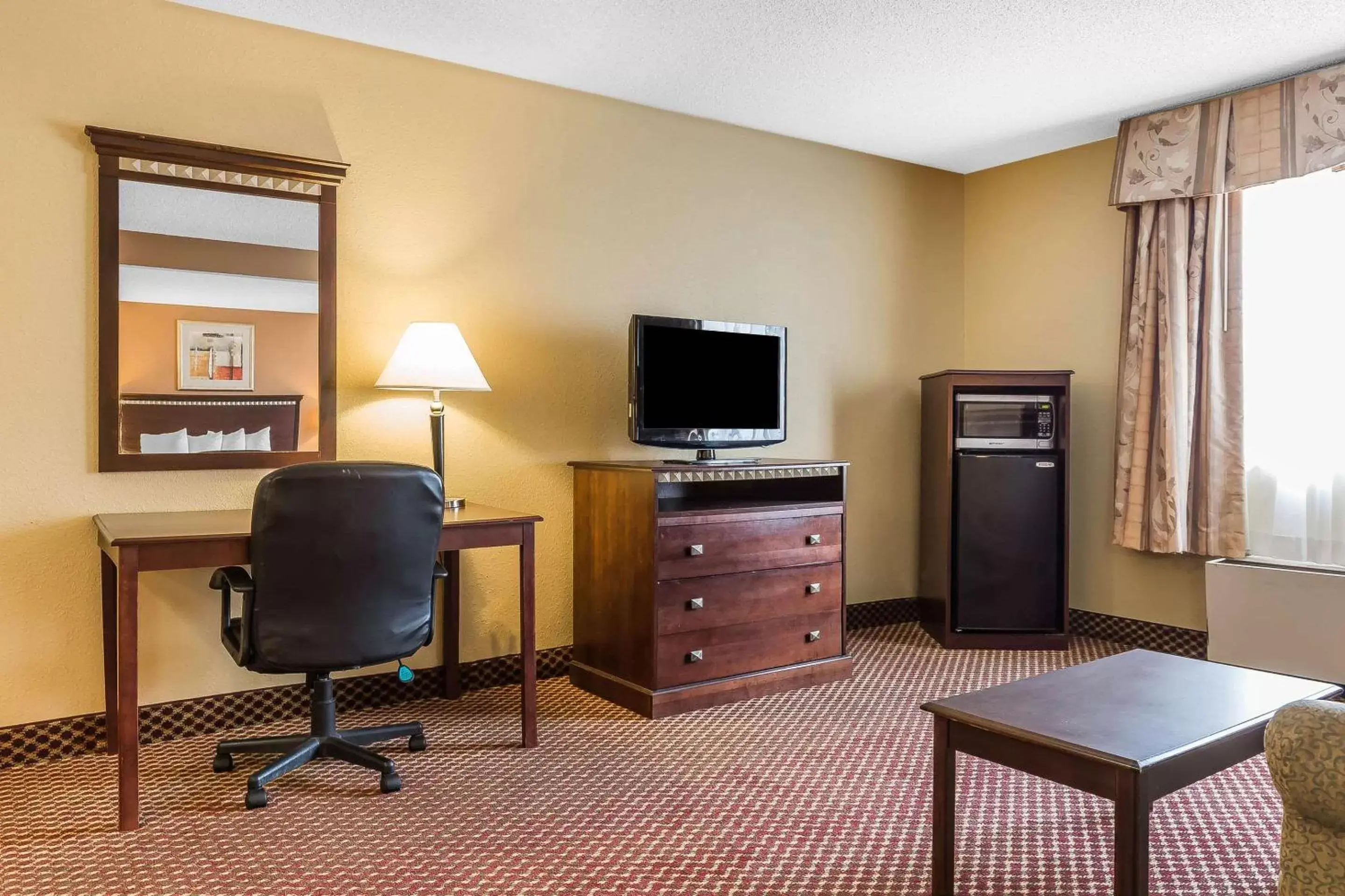 Photo of the whole room, TV/Entertainment Center in Quality Inn & Suites Bloomington University Area