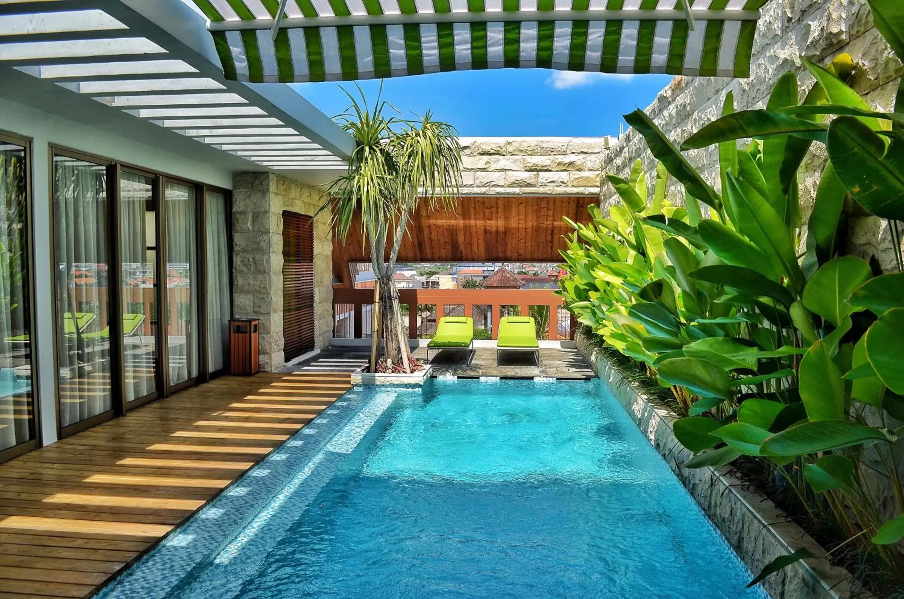 Photo of the whole room, Swimming Pool in TS SUITES Seminyak Bali