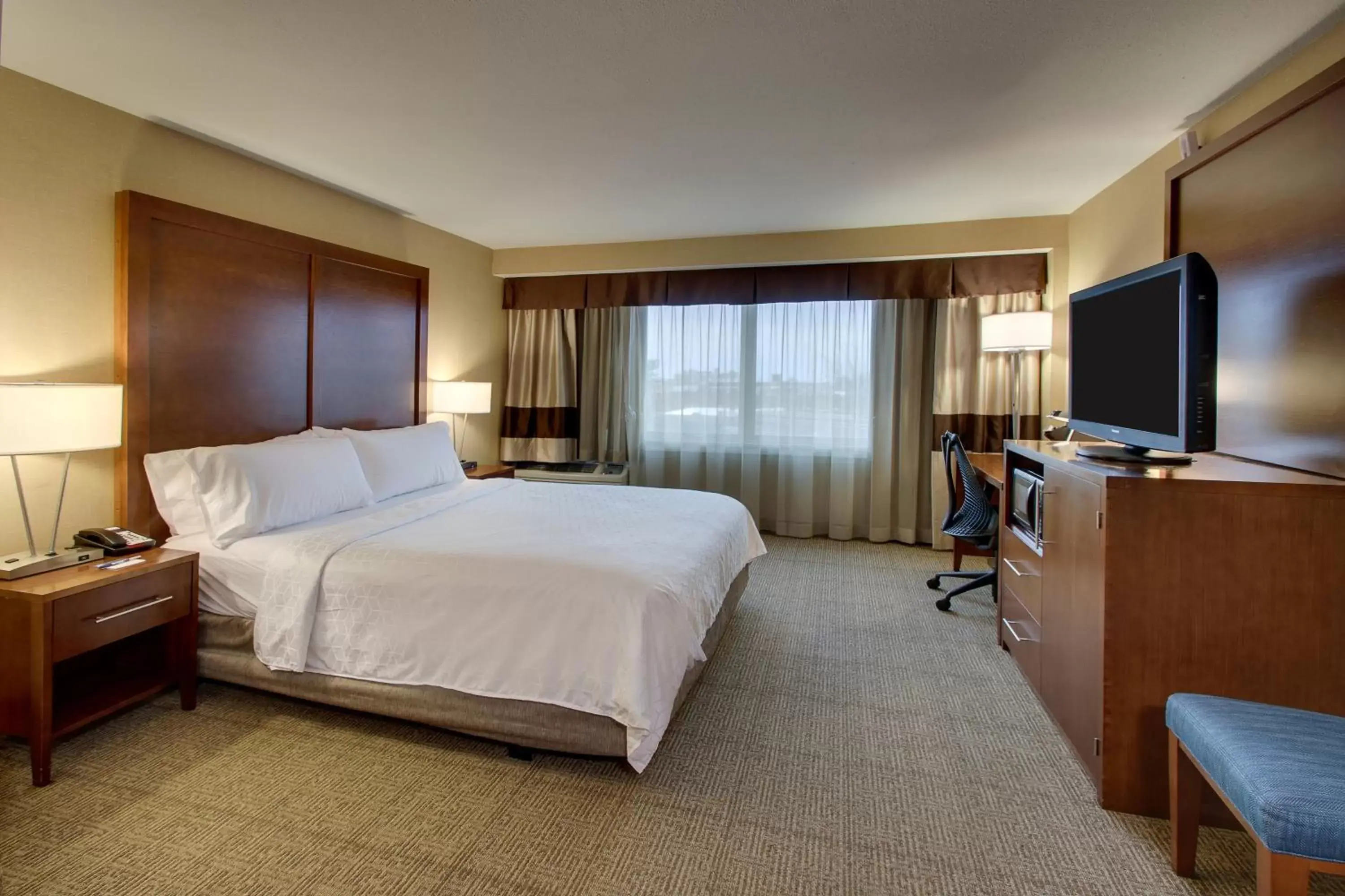 Photo of the whole room, TV/Entertainment Center in Holiday Inn Express Washington DC Silver Spring, an IHG Hotel