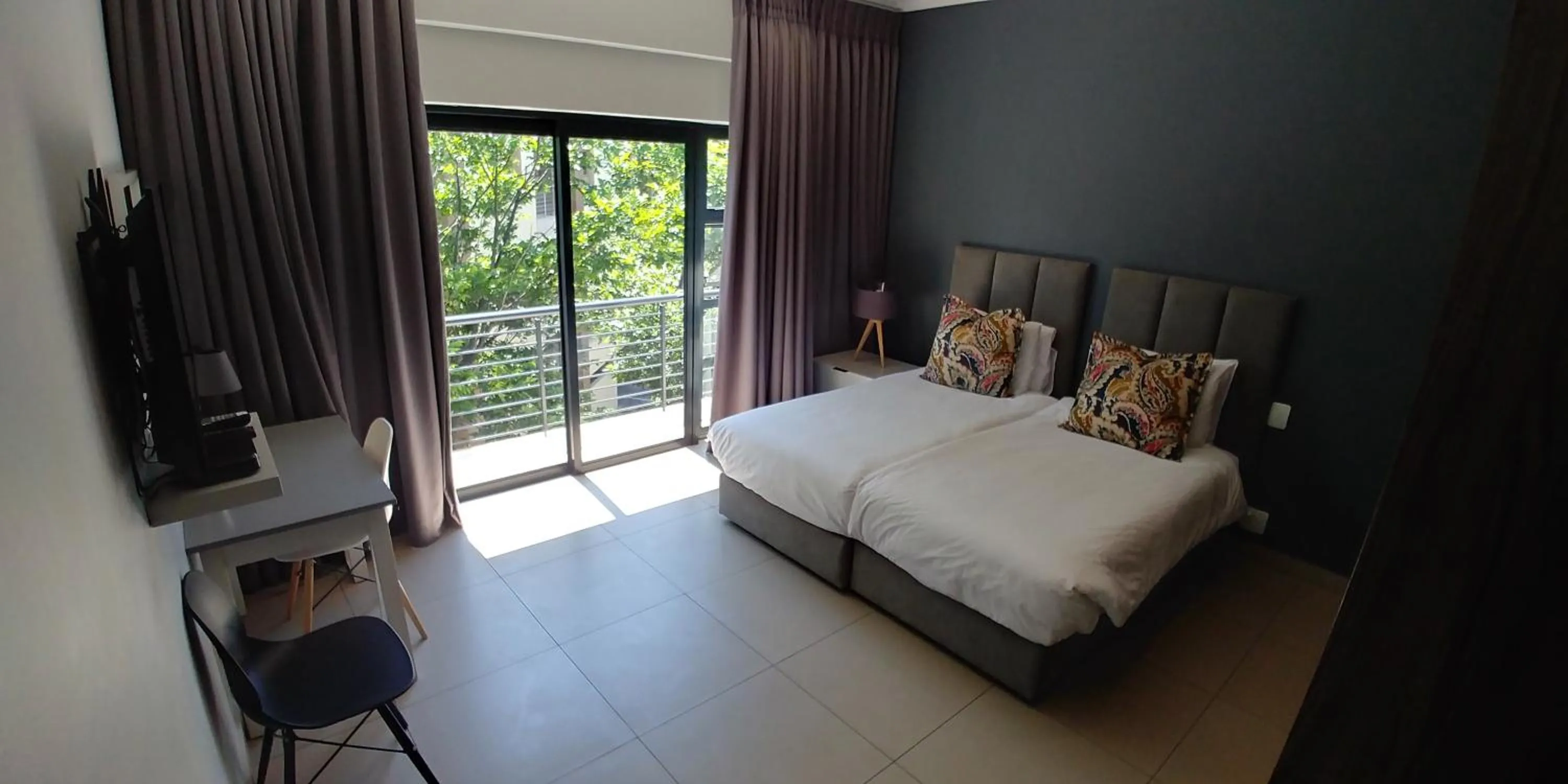 Bed in Odyssey Luxury Apartments - Back Up Generator