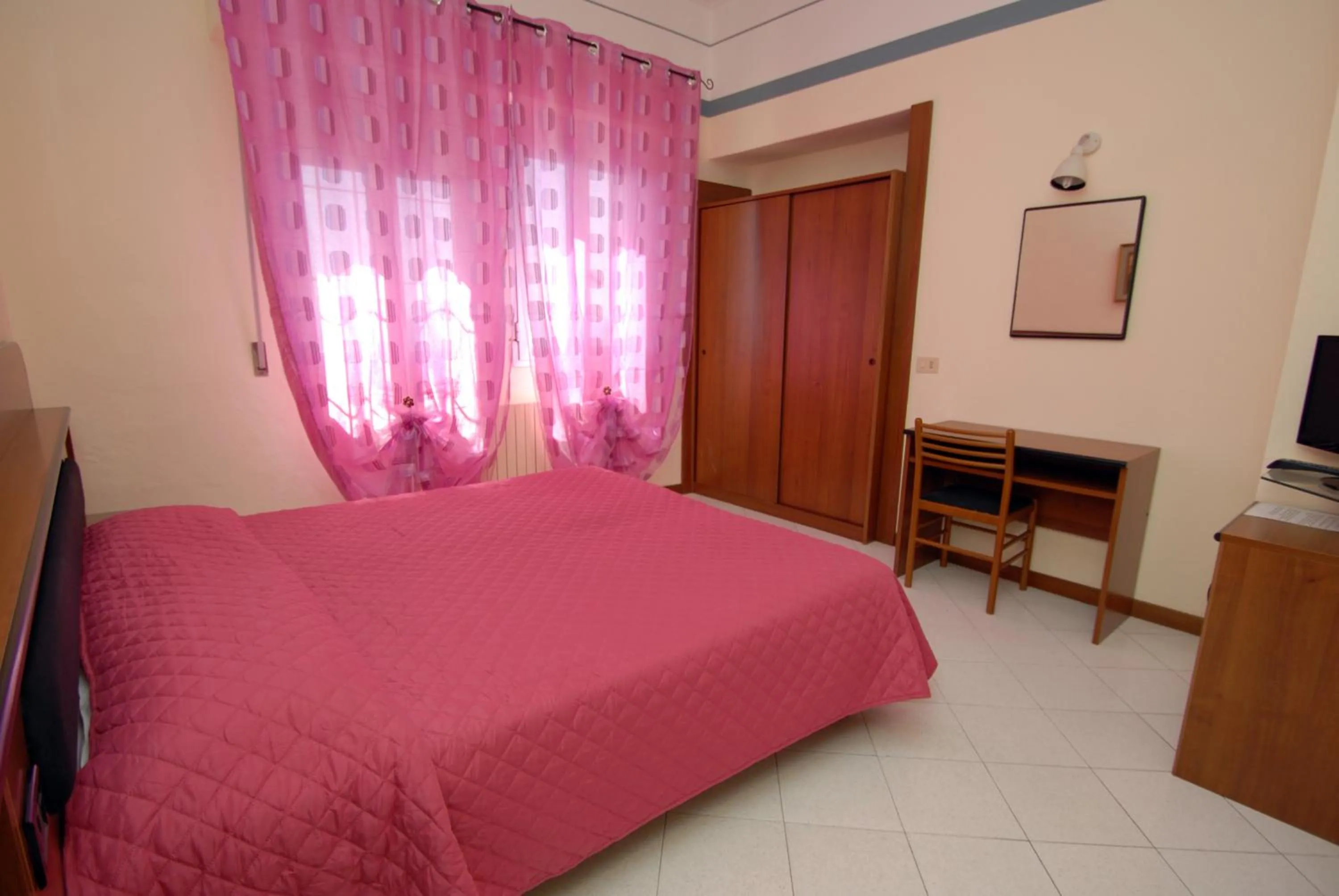 Bed in Hotel Baia Del Sorriso