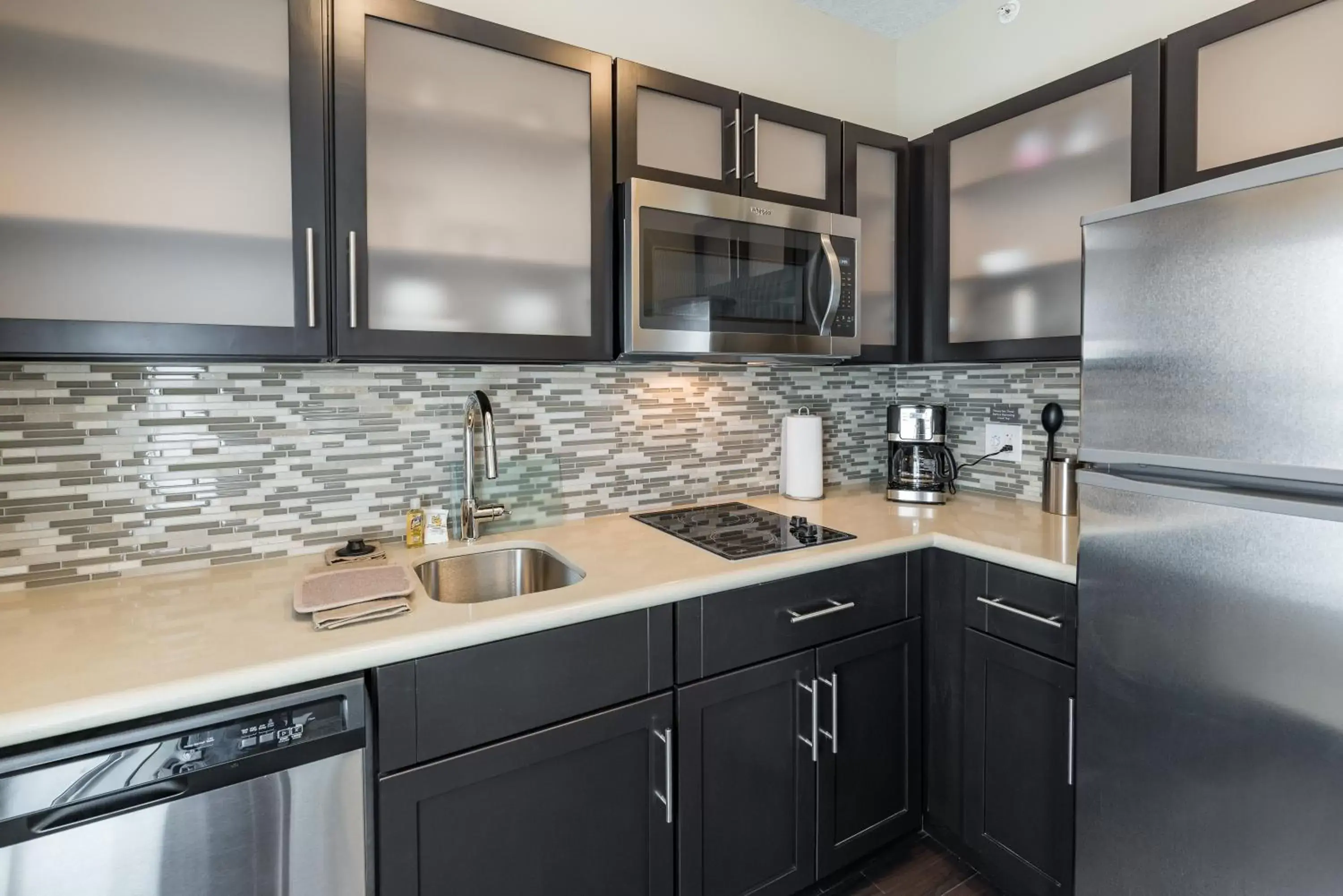 Photo of the whole room, Kitchen/Kitchenette in Staybridge Suites - Saskatoon - University, an IHG Hotel