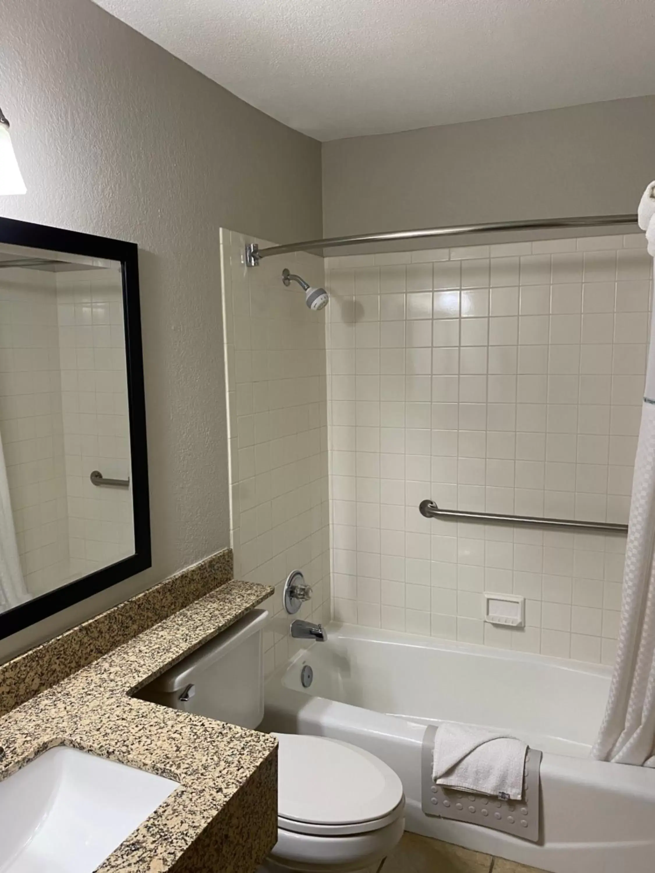 Bathroom in Days Inn & Suites by Wyndham Des Moines Airport