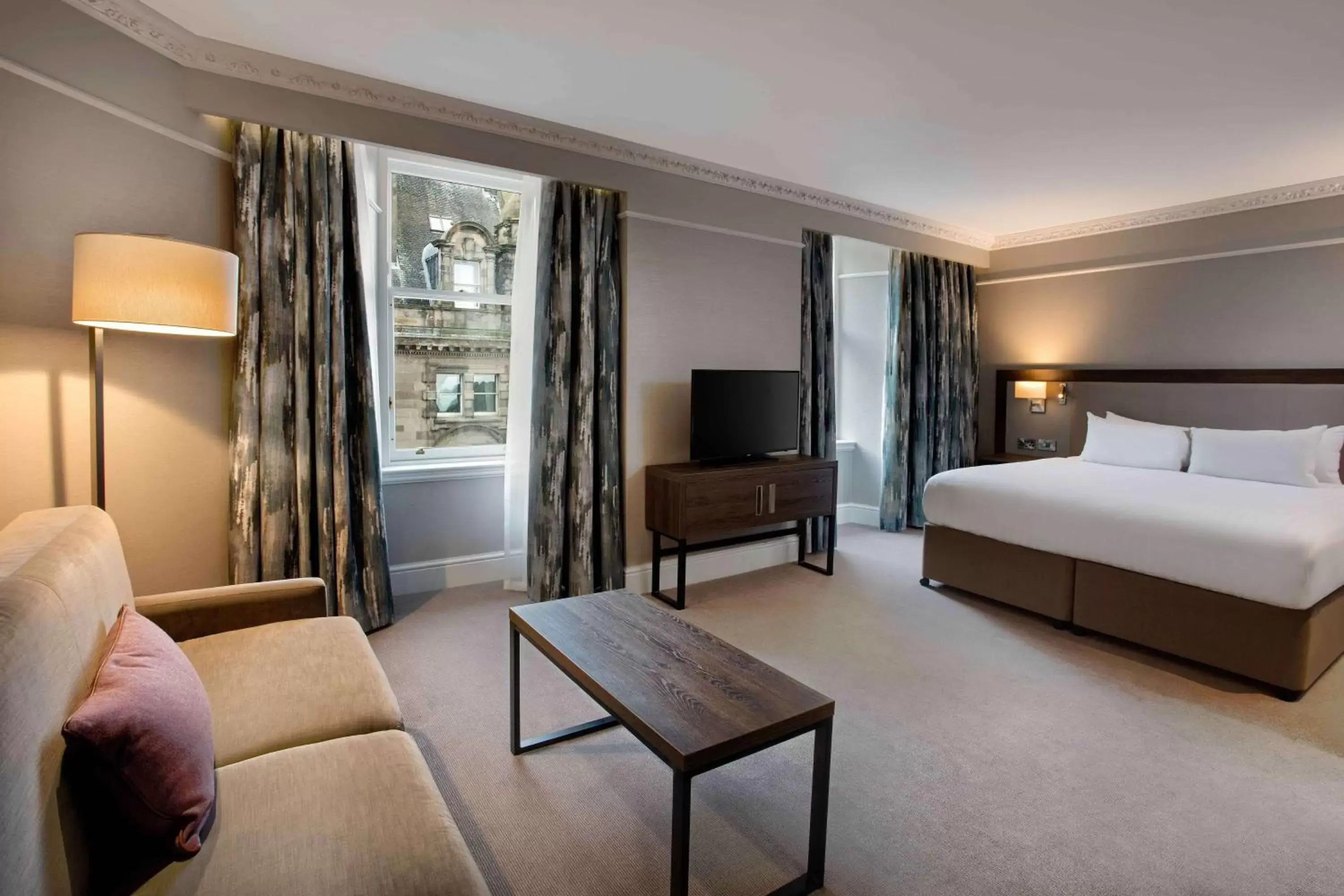 Bed, Seating Area in Hilton Edinburgh Carlton