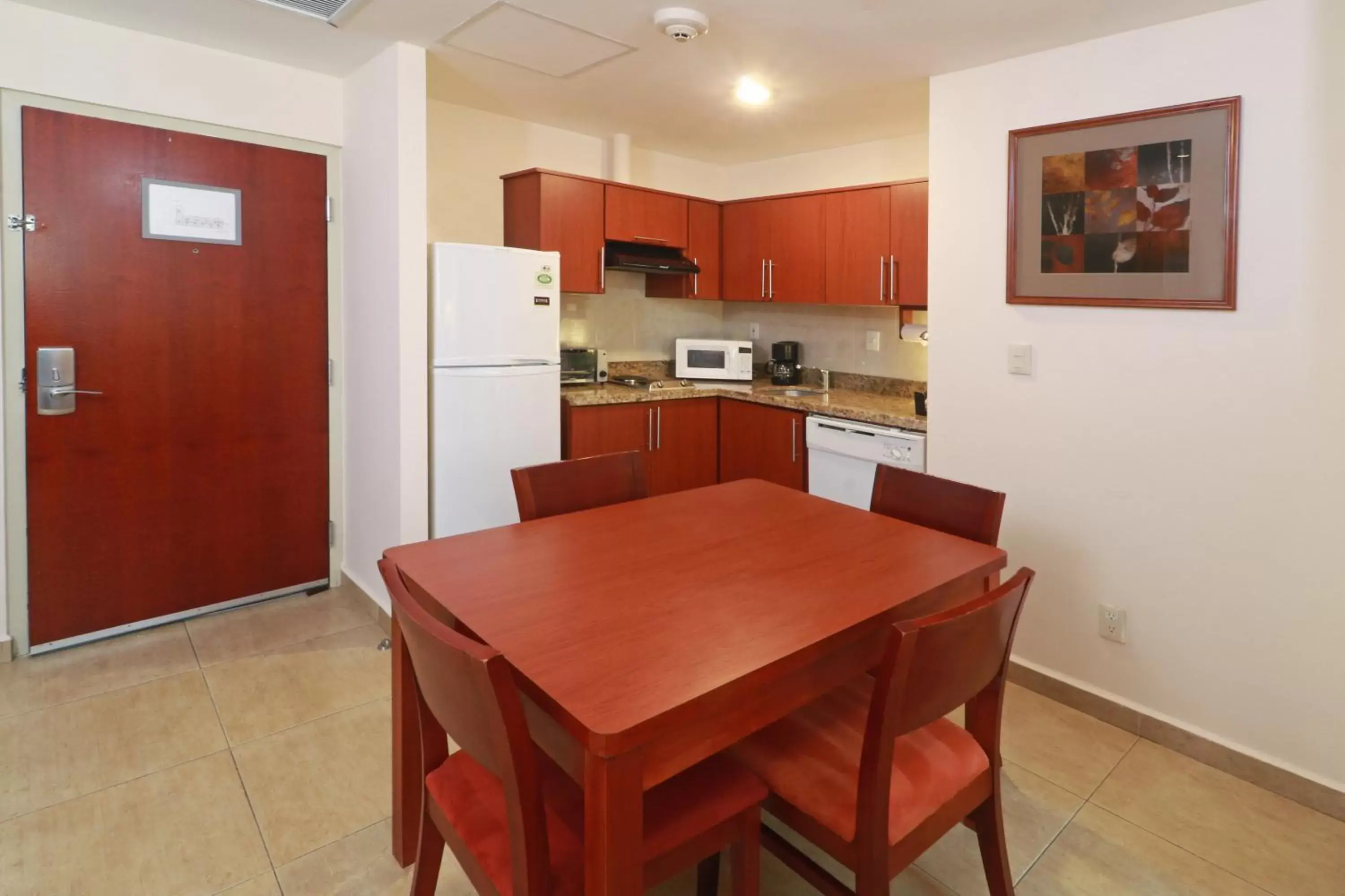 Bedroom, Kitchen/Kitchenette in Staybridge Suites Queretaro, an IHG Hotel