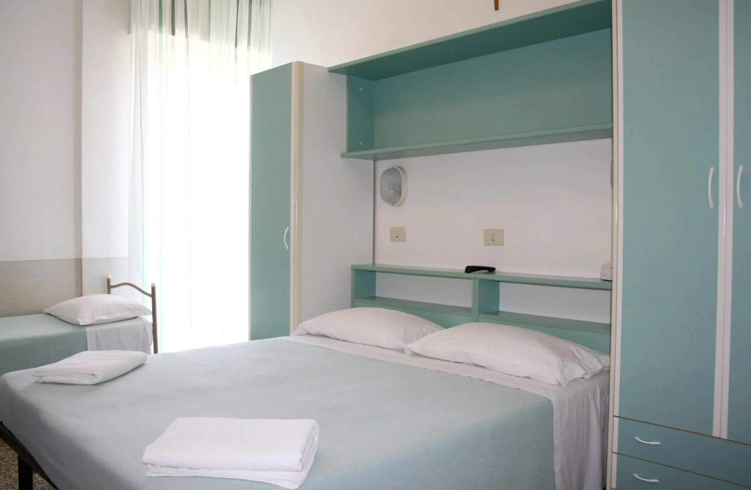 Bed in Hotel Urania