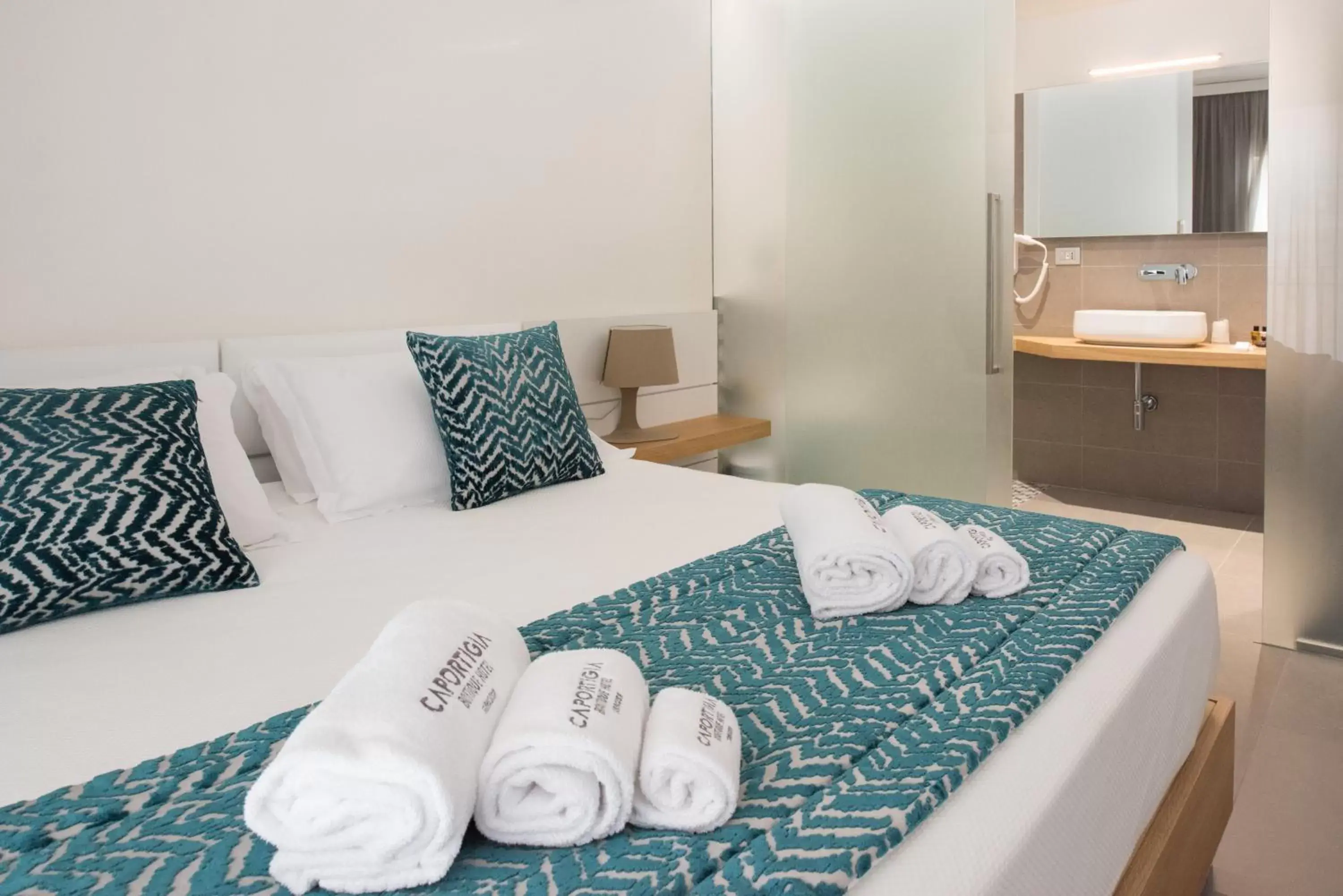 Bed in Caportigia Boutique Hotel