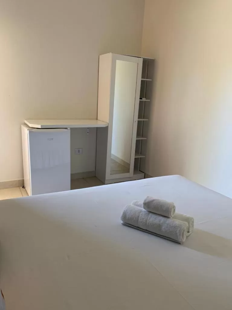 Bed in Pousada Recanto Som do Mar