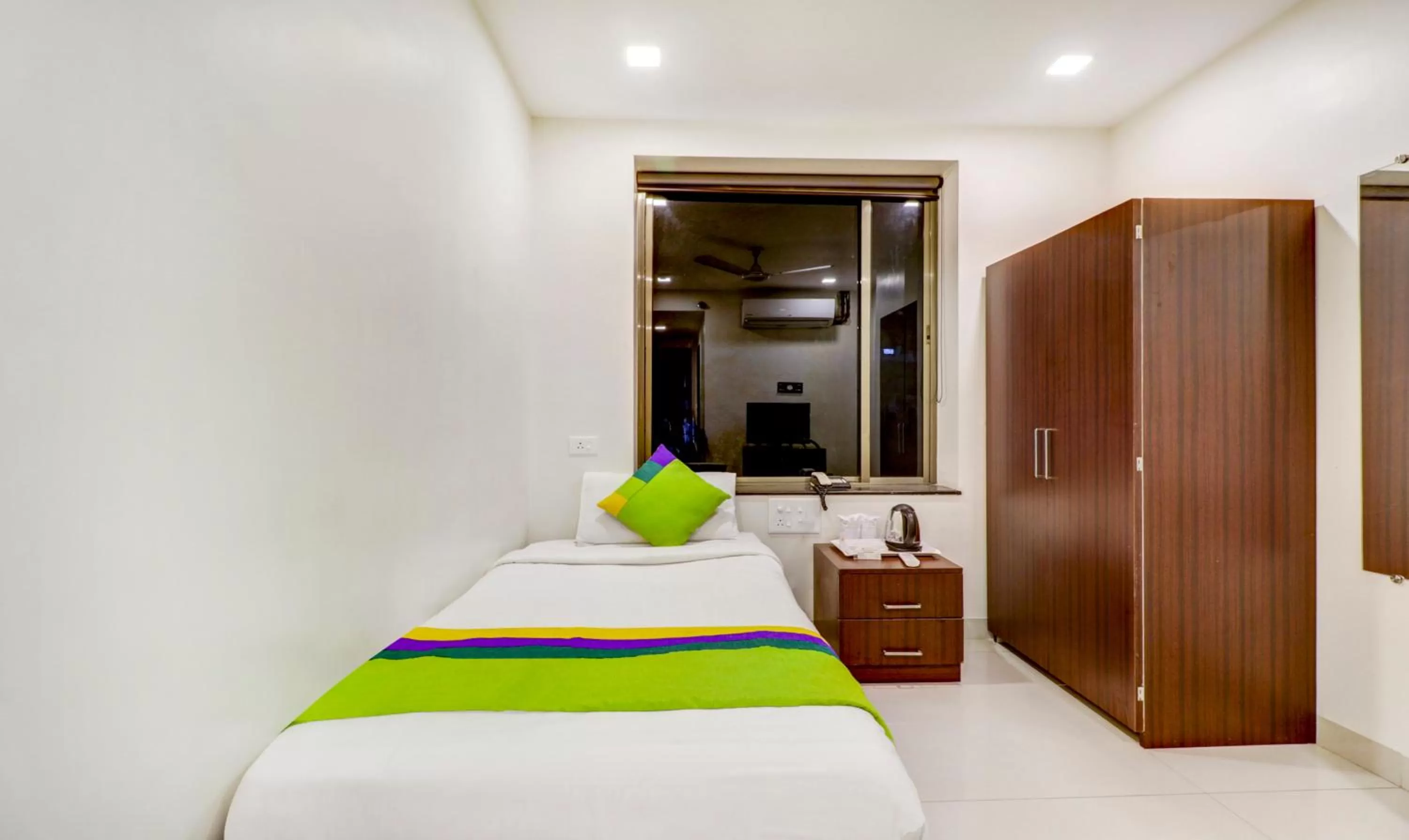 Bed in Treebo Trend Orange City