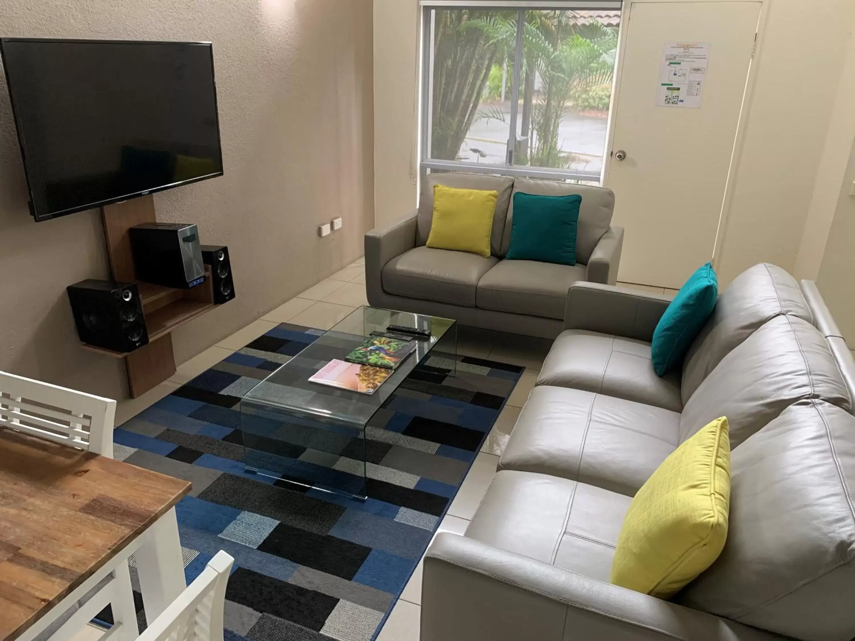 Communal lounge/ TV room, Seating Area in Reef Resort Villas Port Douglas
