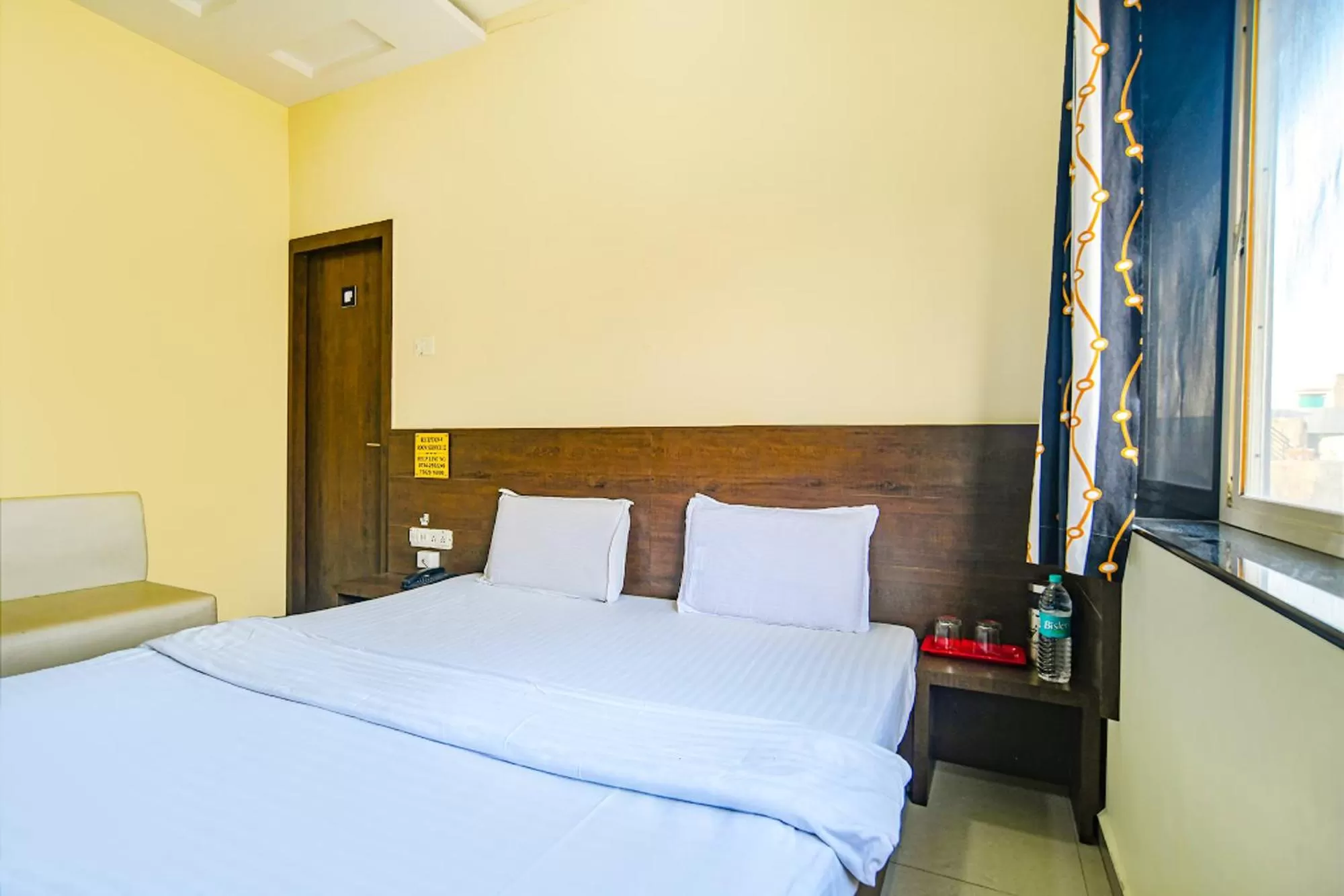 Bed in FabHotel Satyug Jaisinghpura