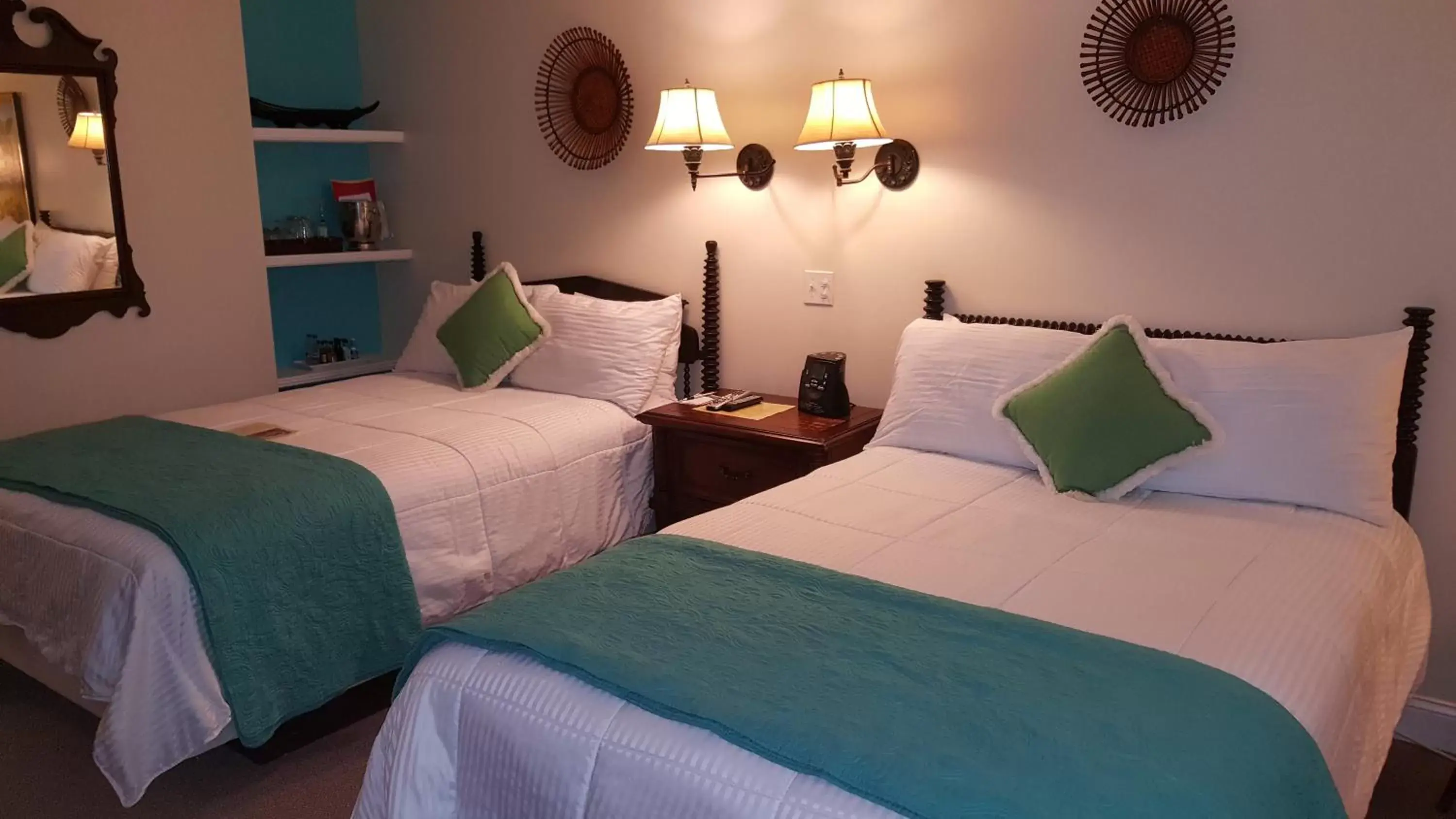 Photo of the whole room, Bed in The Caribbean Court Boutique Hotel