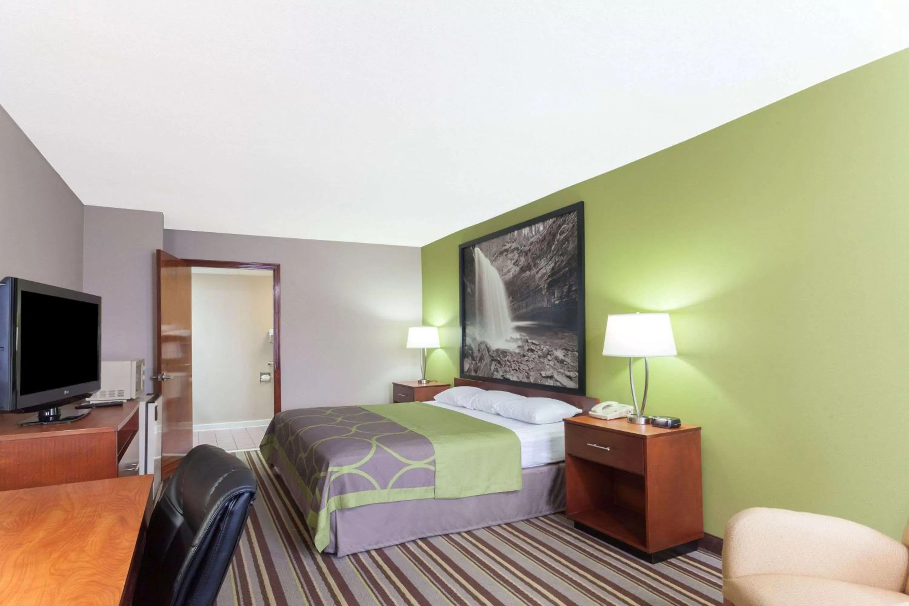 On site, Bed in Super 8 by Wyndham Clarksville Northeast