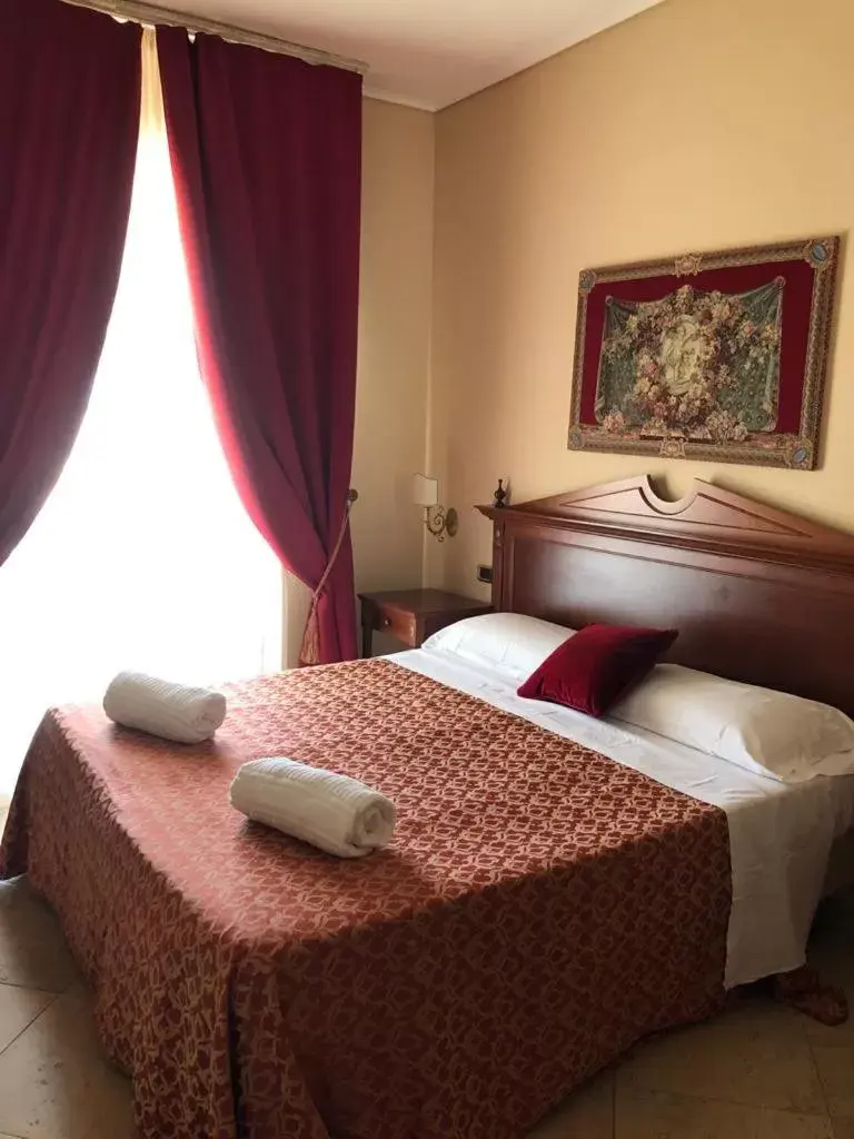 Bed in D'Angelo Palace Hotel