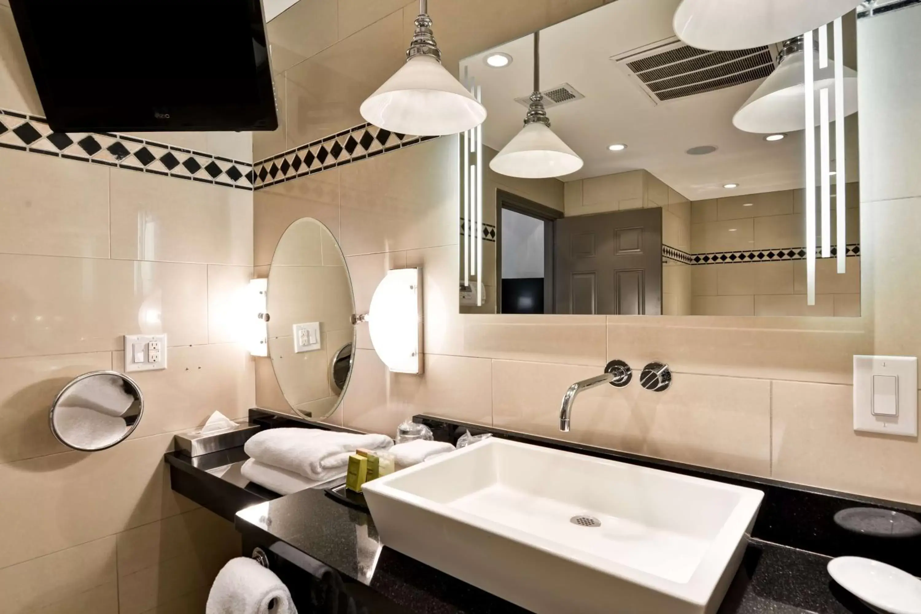 Bathroom in The Cincinnatian Curio Collection by Hilton