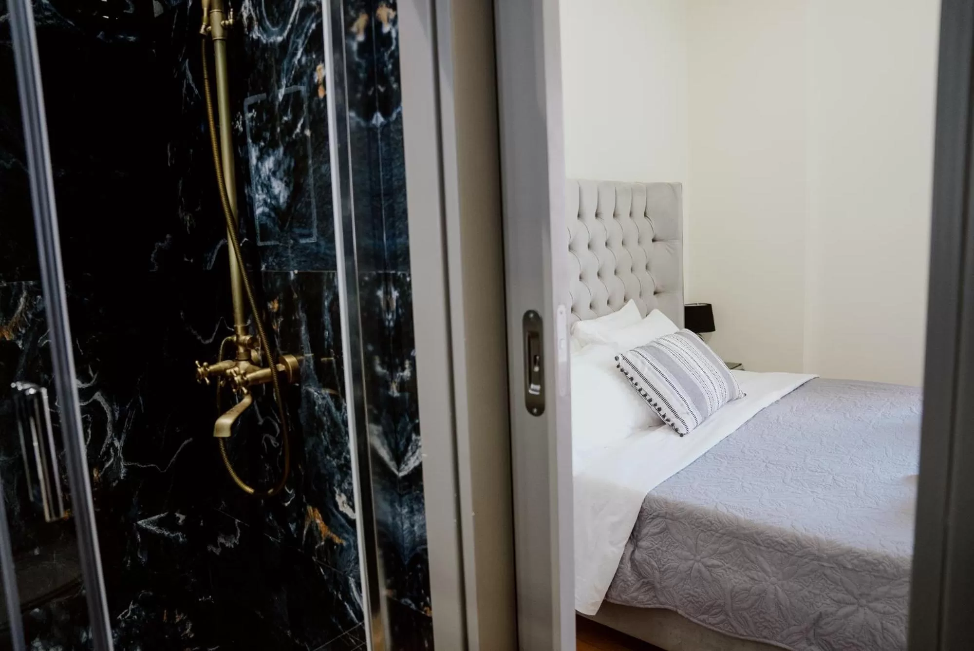 Photo of the whole room, Bed in ROH Suites