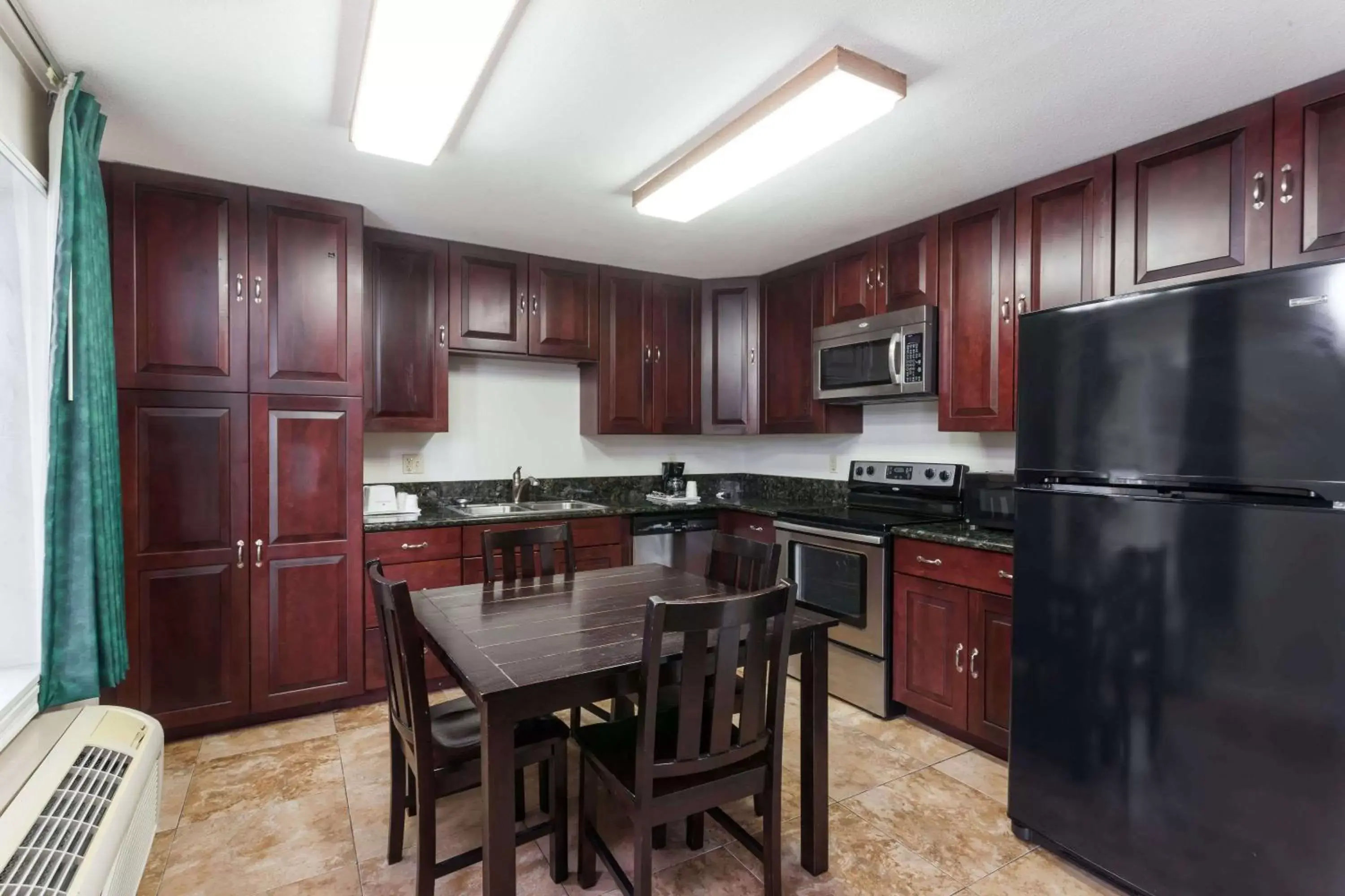 Photo of the whole room, Kitchen/Kitchenette in Ramada by Wyndham Oceanside