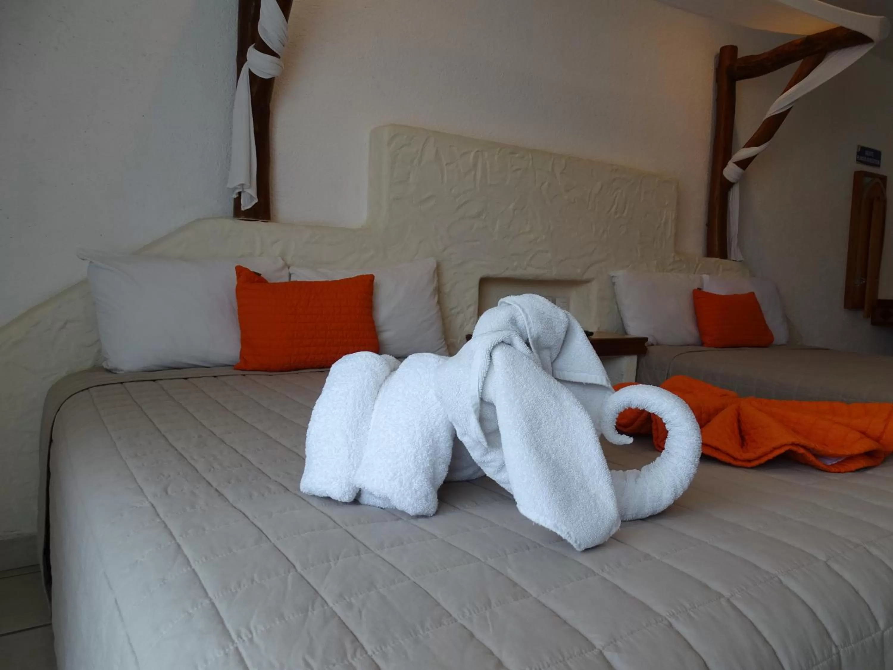 Bed in Hotel Palapa Palace