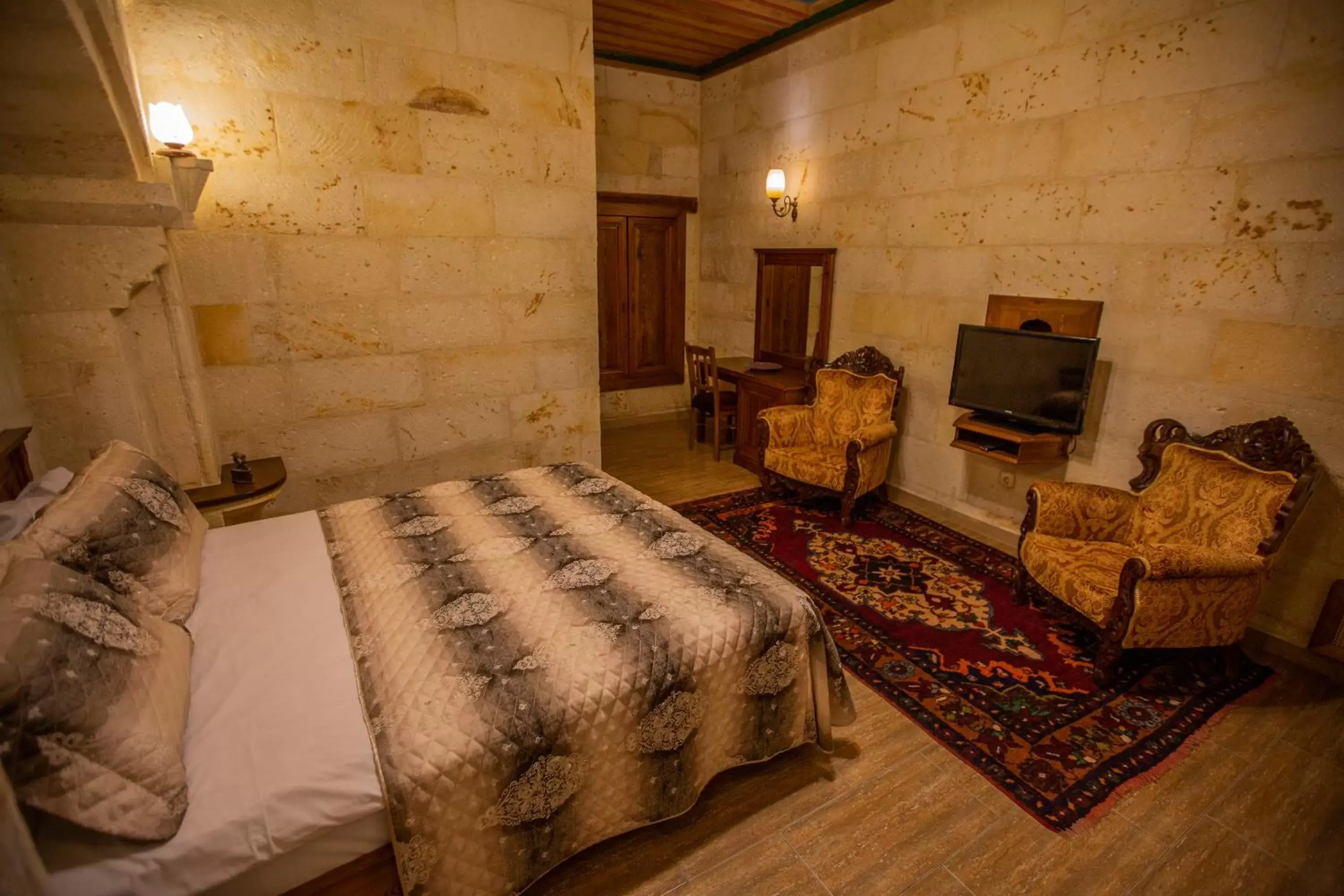 Photo of the whole room, Bed in Stone House Cave Hotel