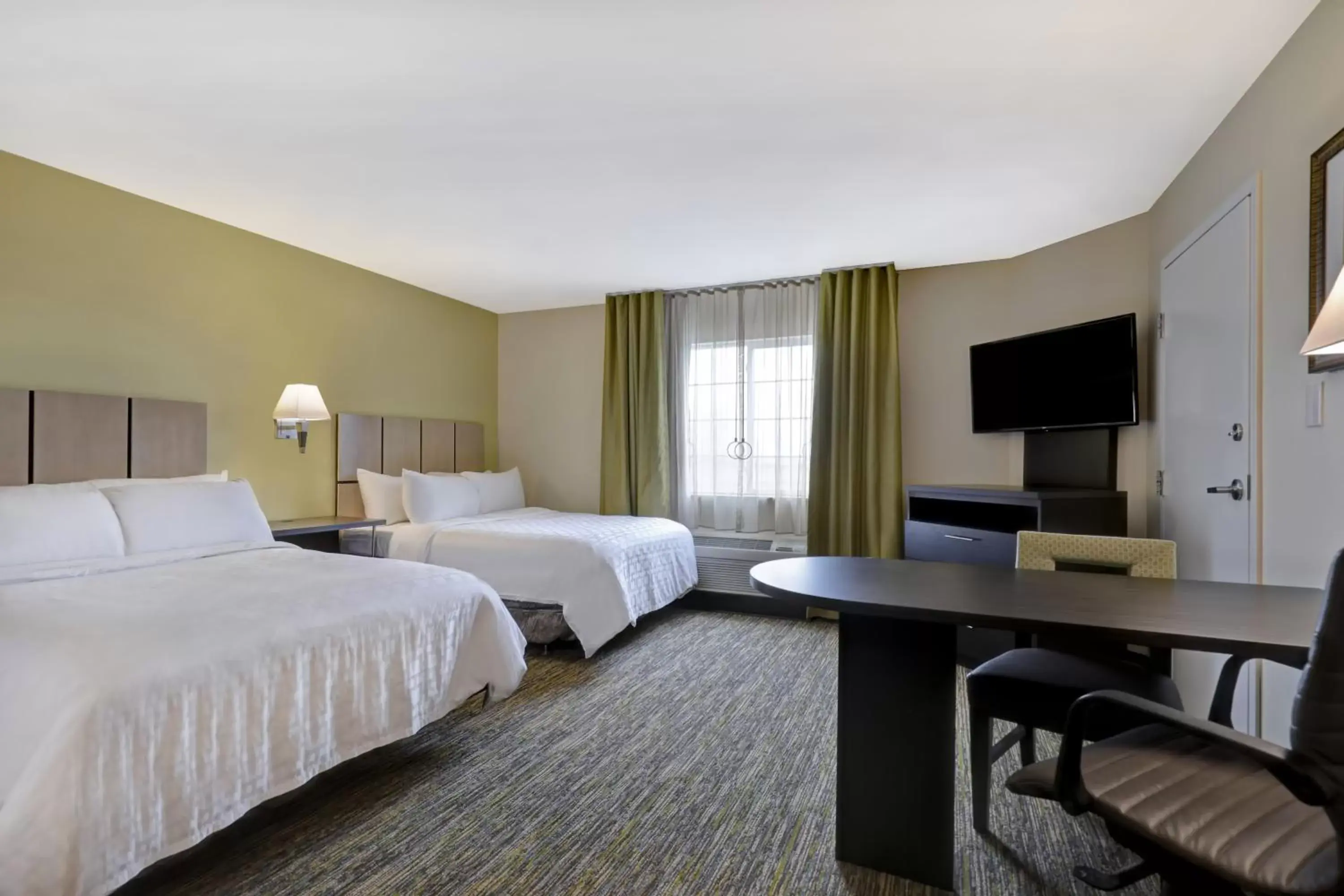 Bedroom in Candlewood Suites Indianapolis - South, an IHG Hotel