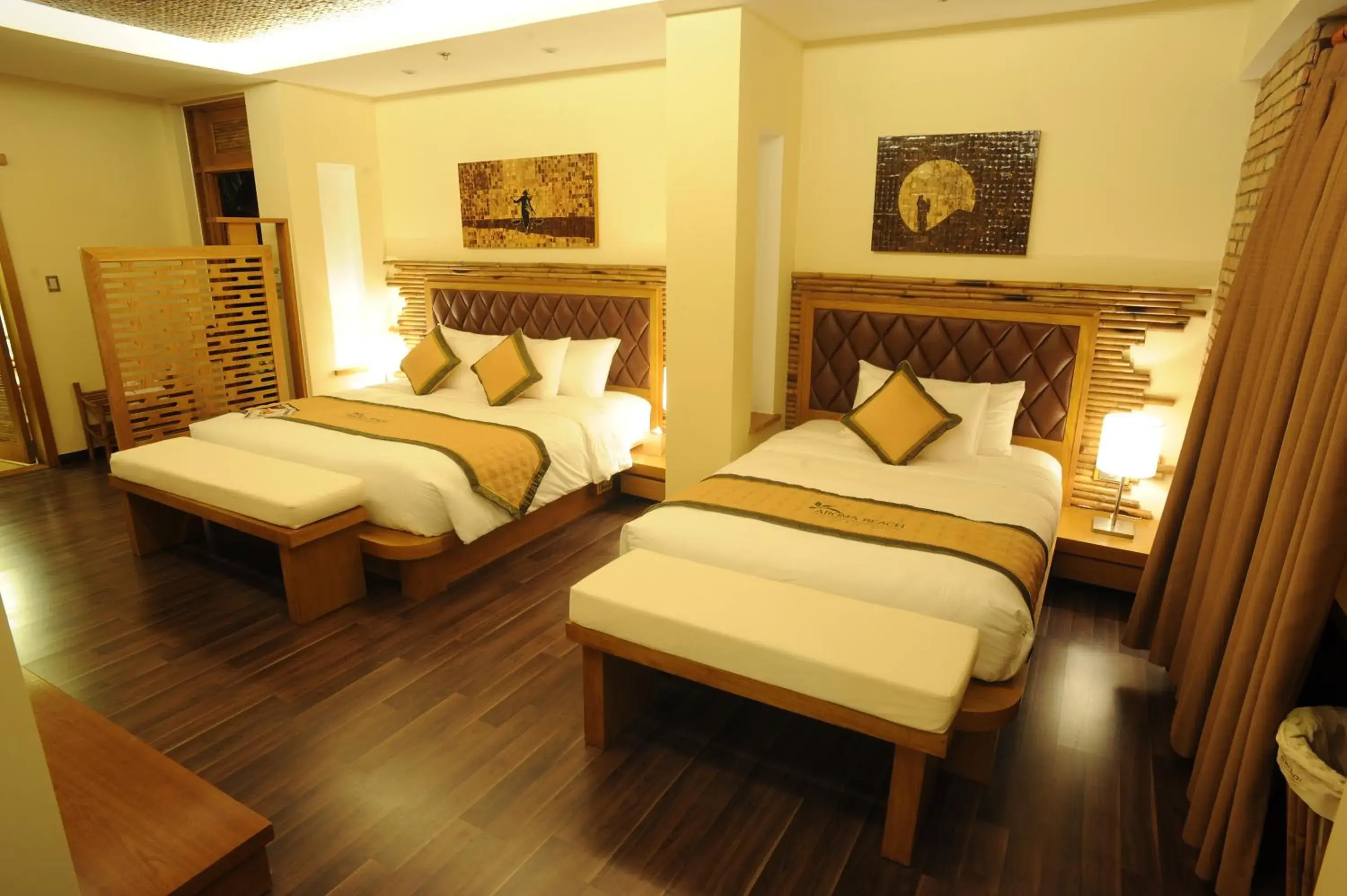 Bed in Aroma Beach Resort and Spa